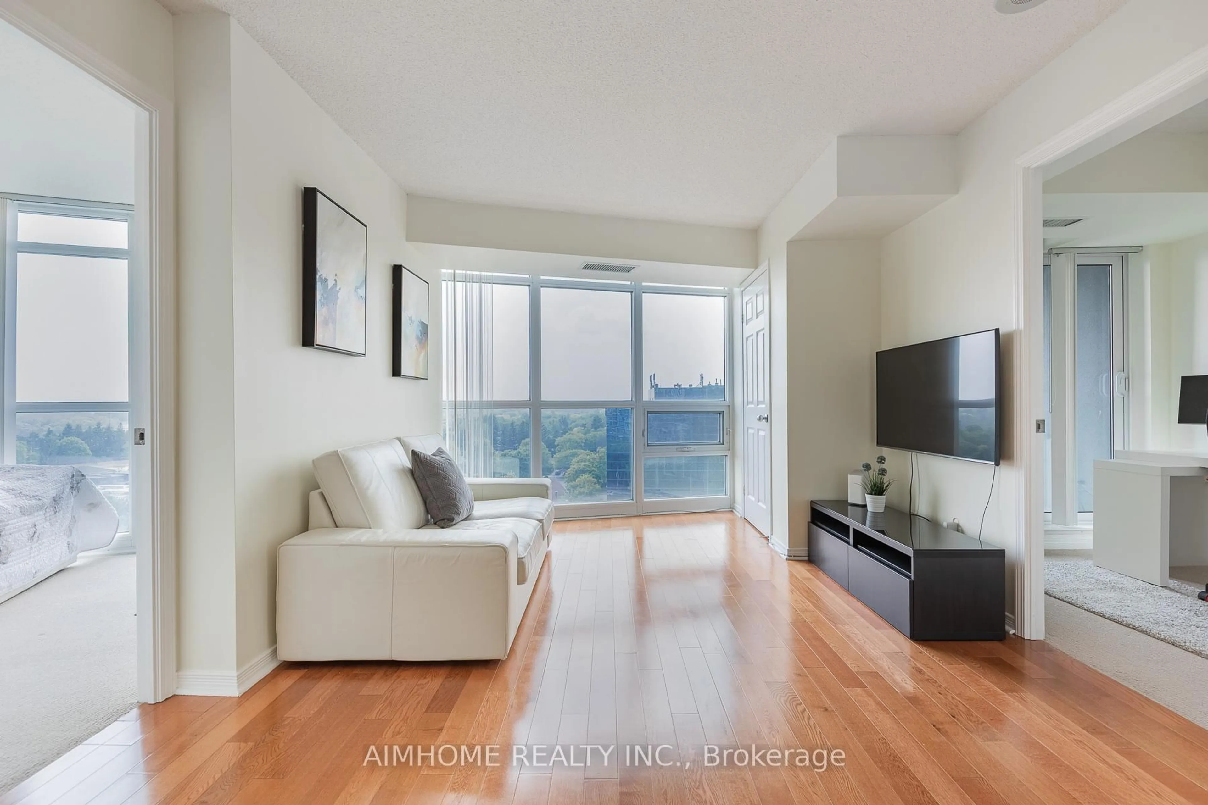 Living room with furniture, wood/laminate floor for 30 Harrison Garden Blvd #1106, Toronto Ontario M2N 7A9