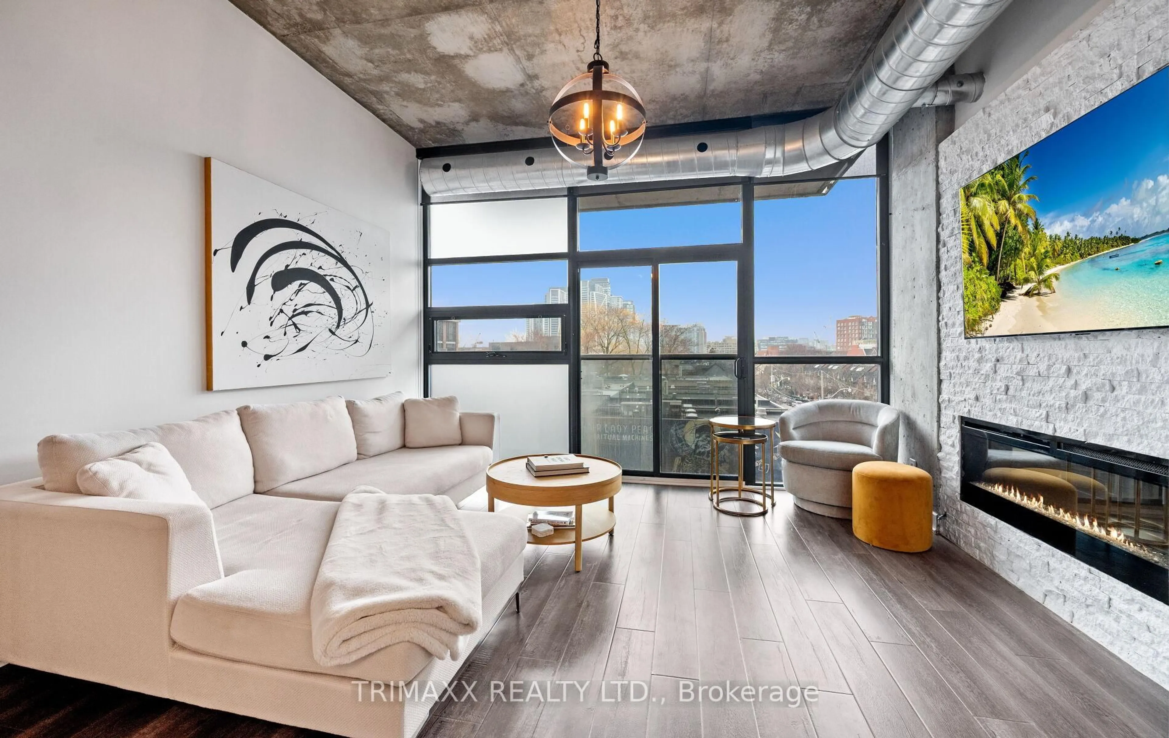 Living room with furniture, cement floor for 60 Bathurst St #403, Toronto Ontario M5V 2P4