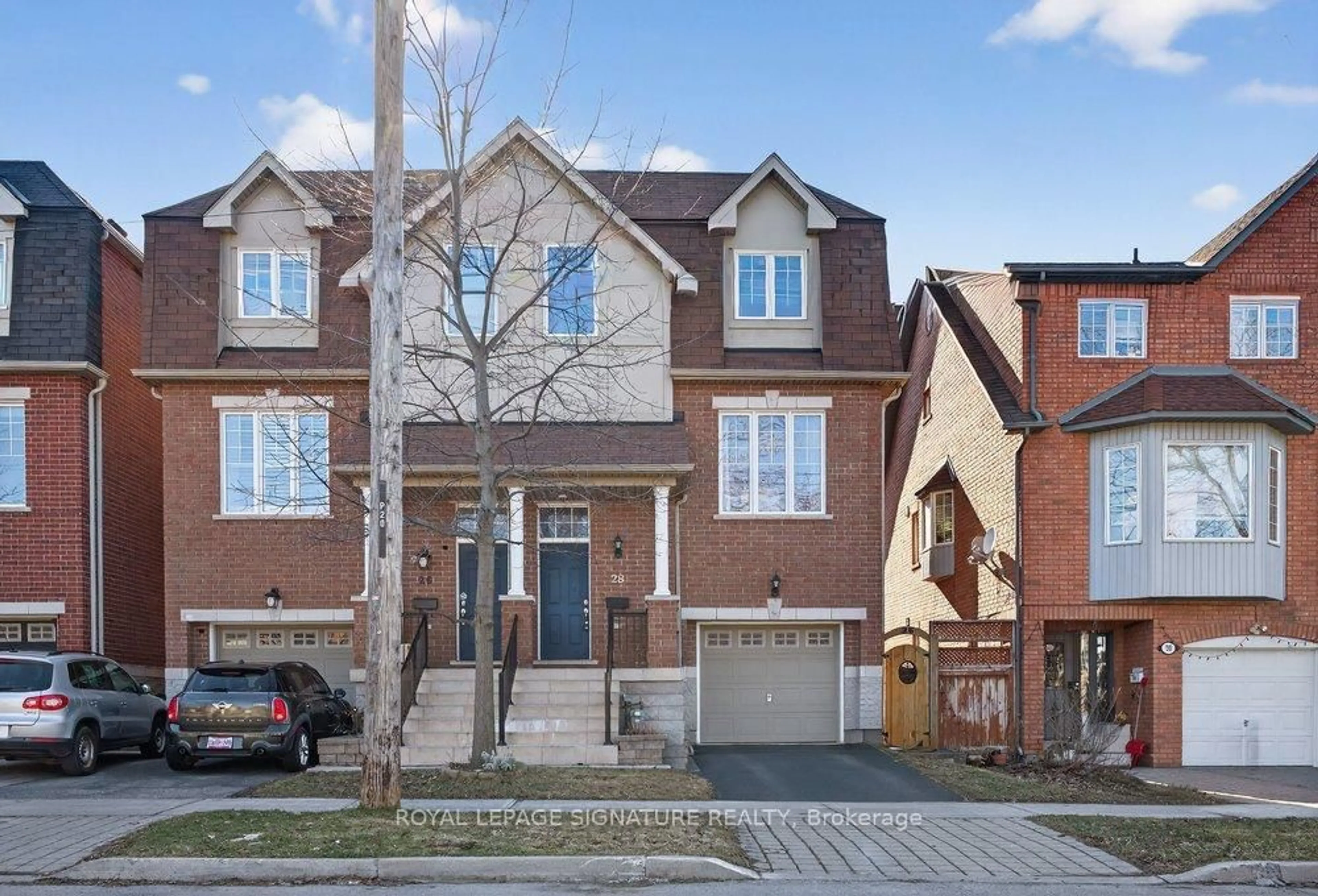 Home with brick exterior material, street for 28 Tisdale Ave, Toronto Ontario M4A 1Y5