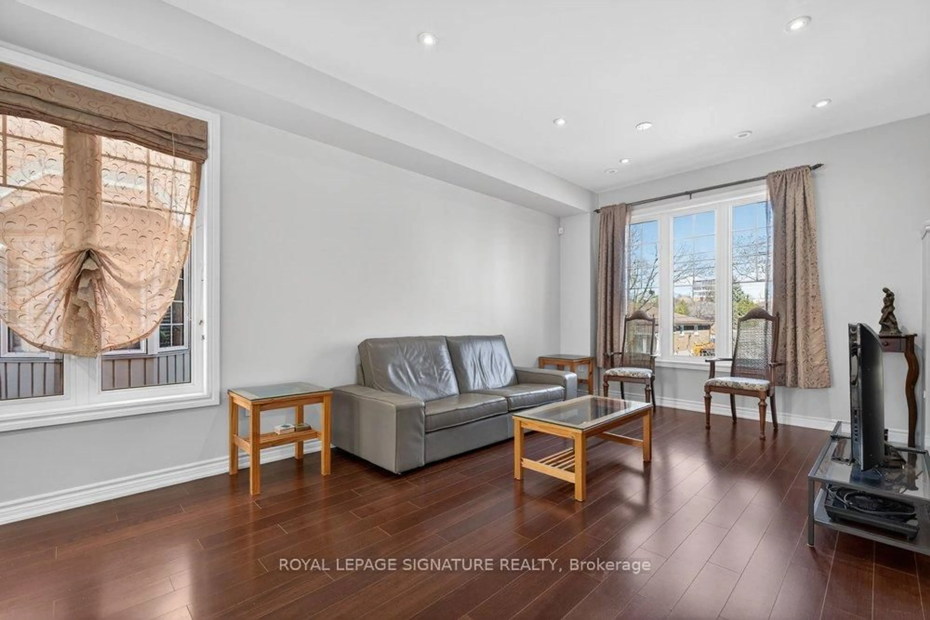 Living room with furniture, wood/laminate floor for 28 Tisdale Ave, Toronto Ontario M4A 1Y5