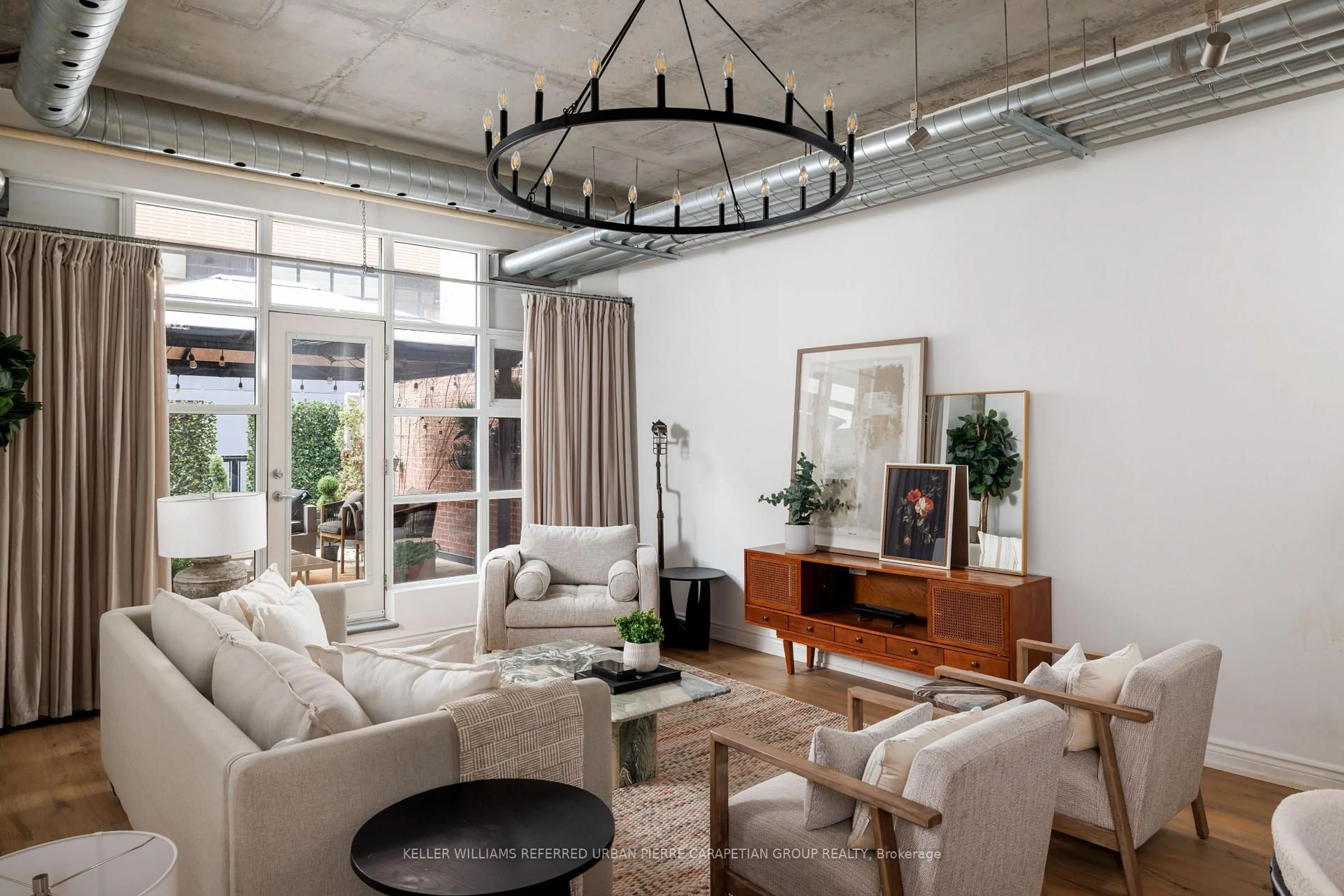 Living room with furniture, cement floor for 261 King St #205, Toronto Ontario M5A 4T6