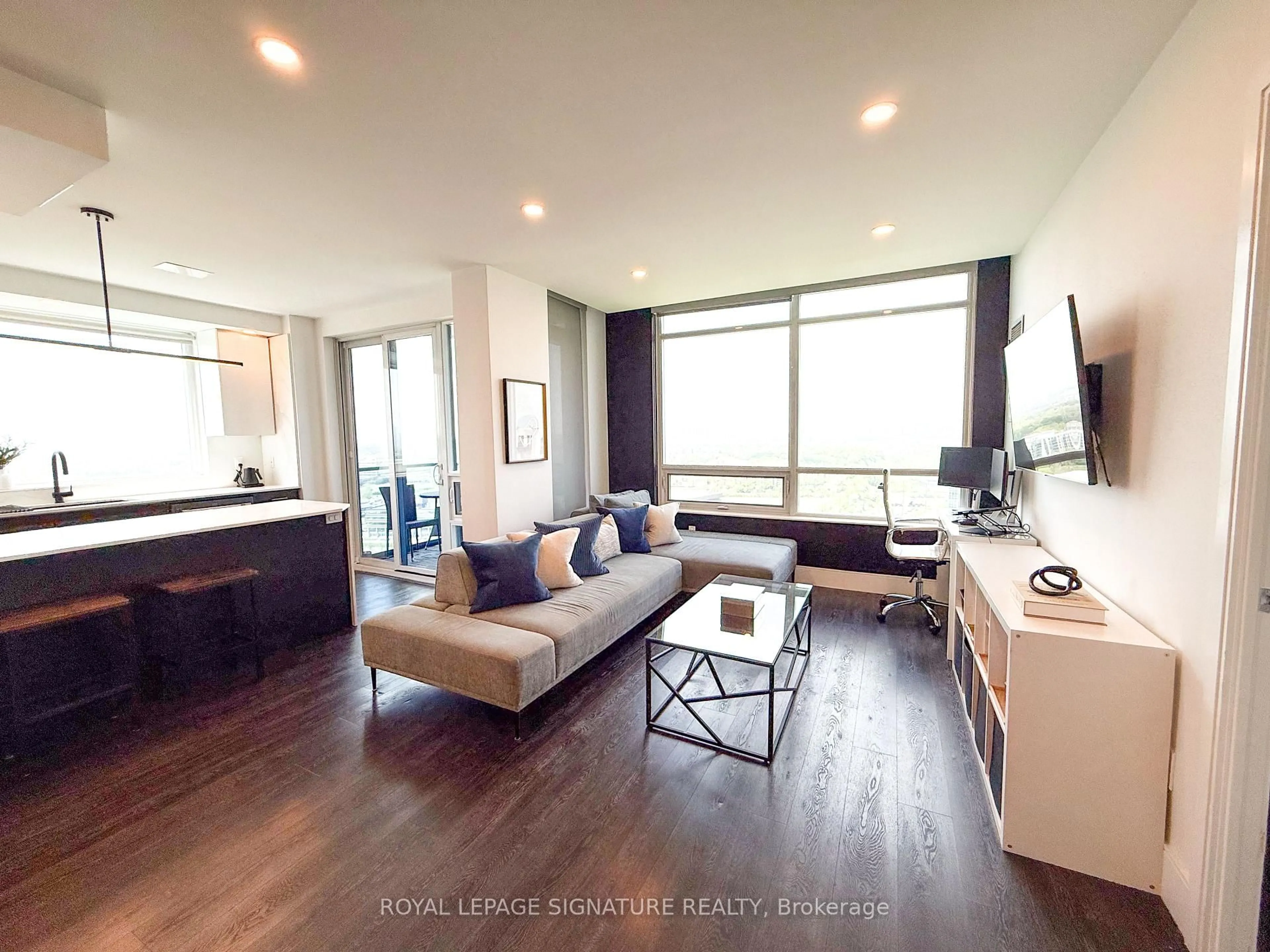 Living room with furniture, wood/laminate floor for 181 Wynford Dr #2607, Toronto Ontario M3C 0C6