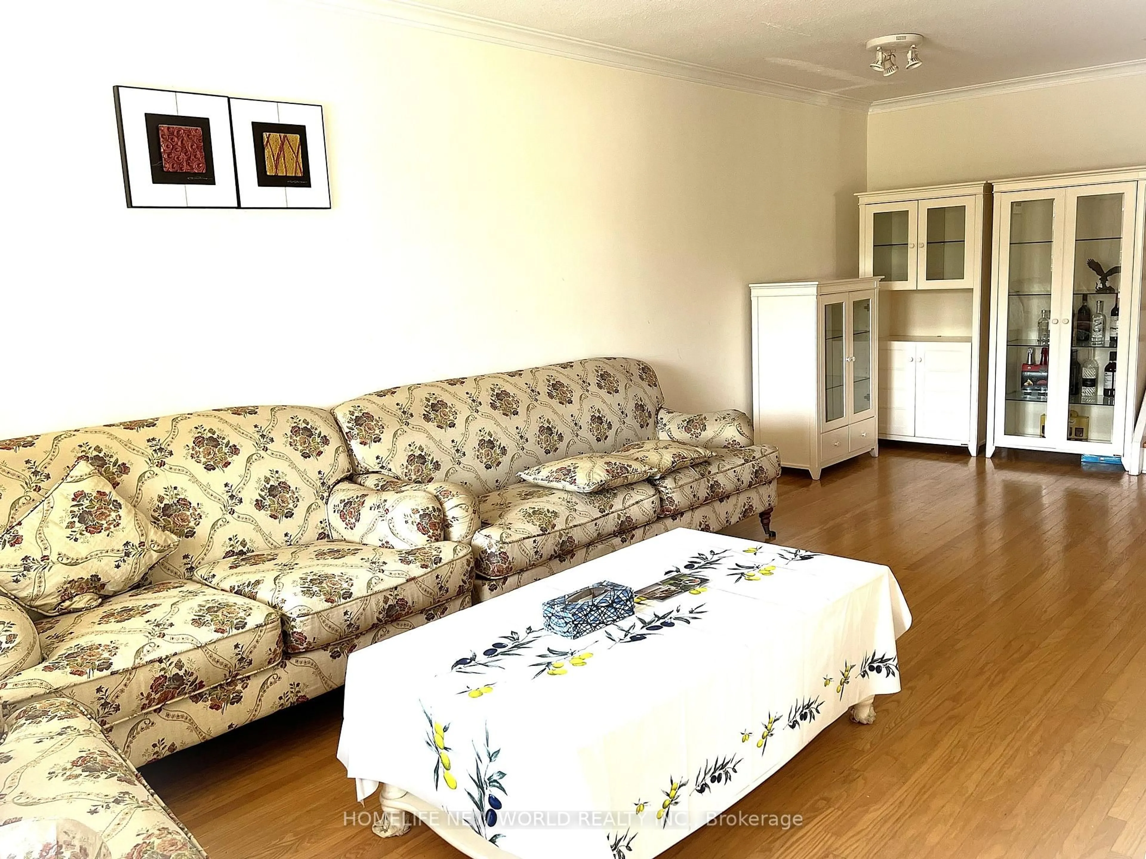 Living room with furniture, wood/laminate floor for 28 Greyhound Dr, Toronto Ontario M2H 1K3