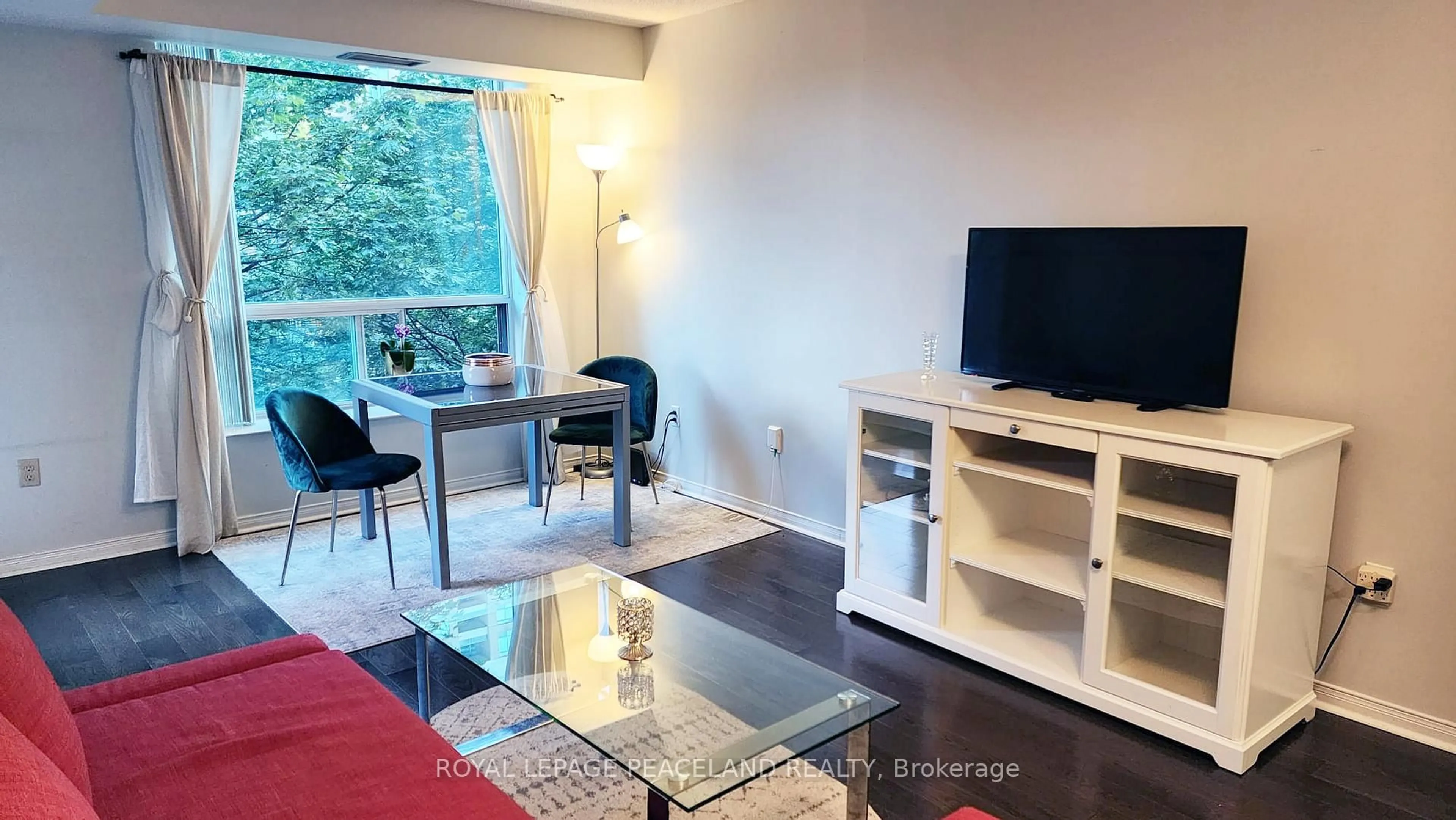 Living room with furniture, wood/laminate floor for 18 Pemberton Ave #409, Toronto Ontario M2M 1Y1