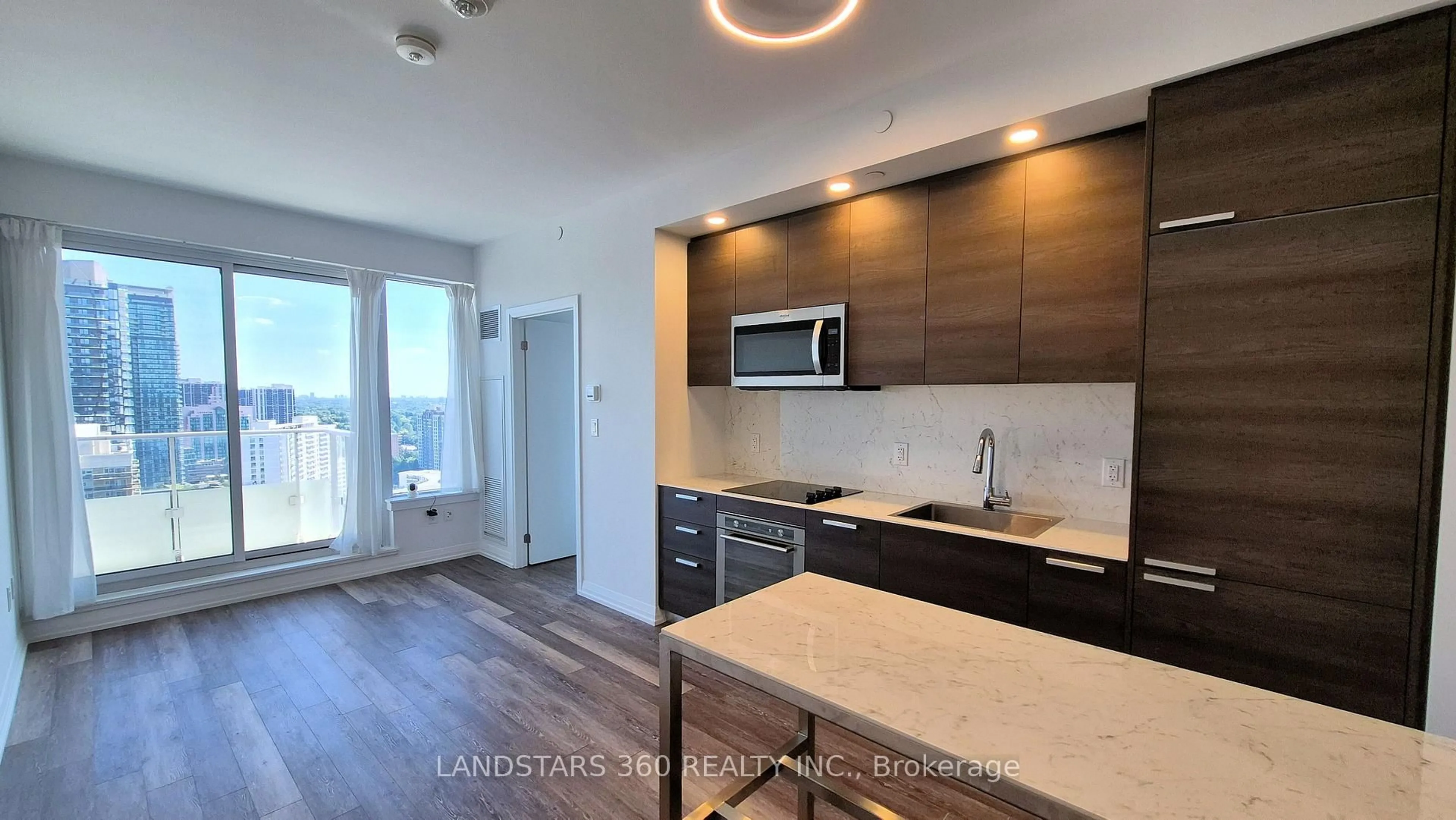 Open concept kitchen, wood/laminate floor for 75 Canterbury Pl #2506, Toronto Ontario M2N 2N1