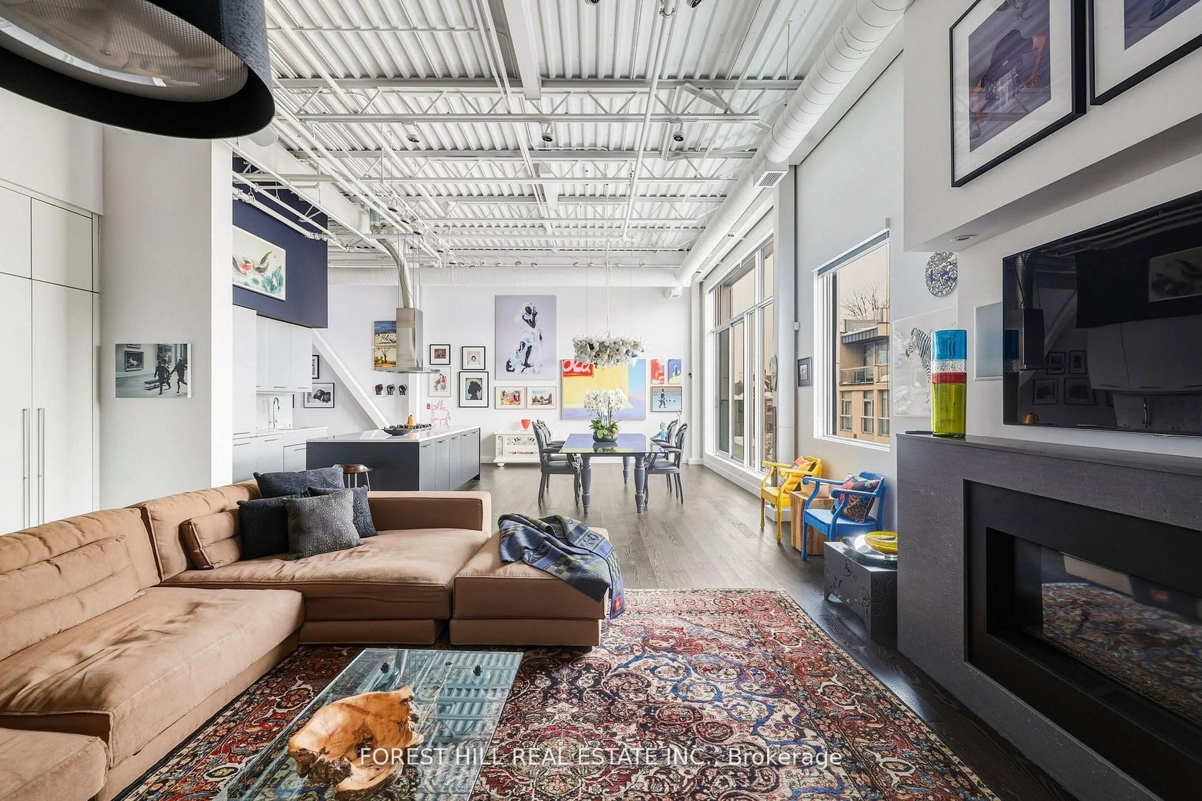 Living room with furniture, cement floor for 113 Dupont St #PH01, Toronto Ontario M5R 1V4