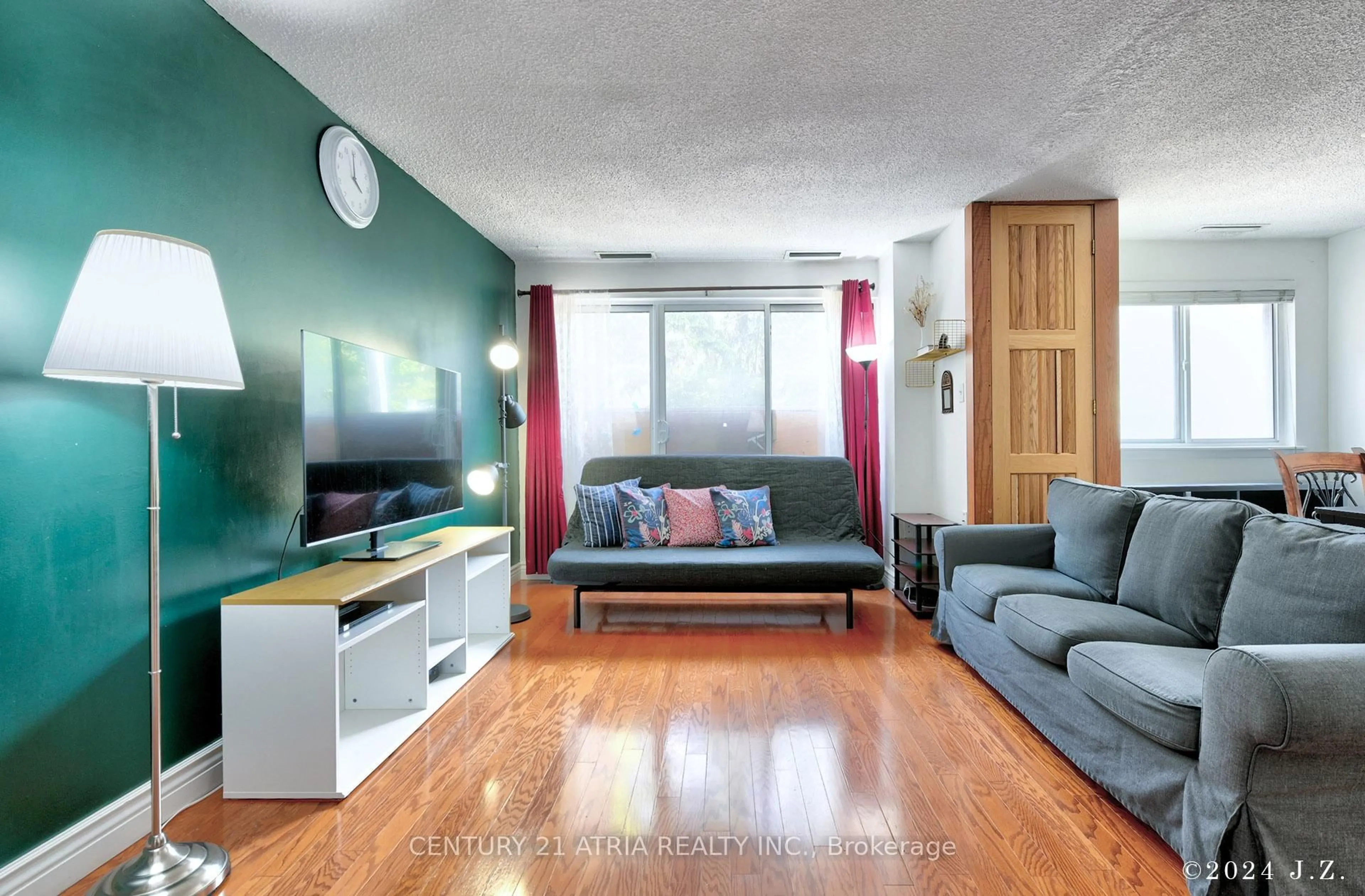 Living room with furniture, wood/laminate floor for 4001 Don Mills Rd #135, Toronto Ontario M2H 3J8