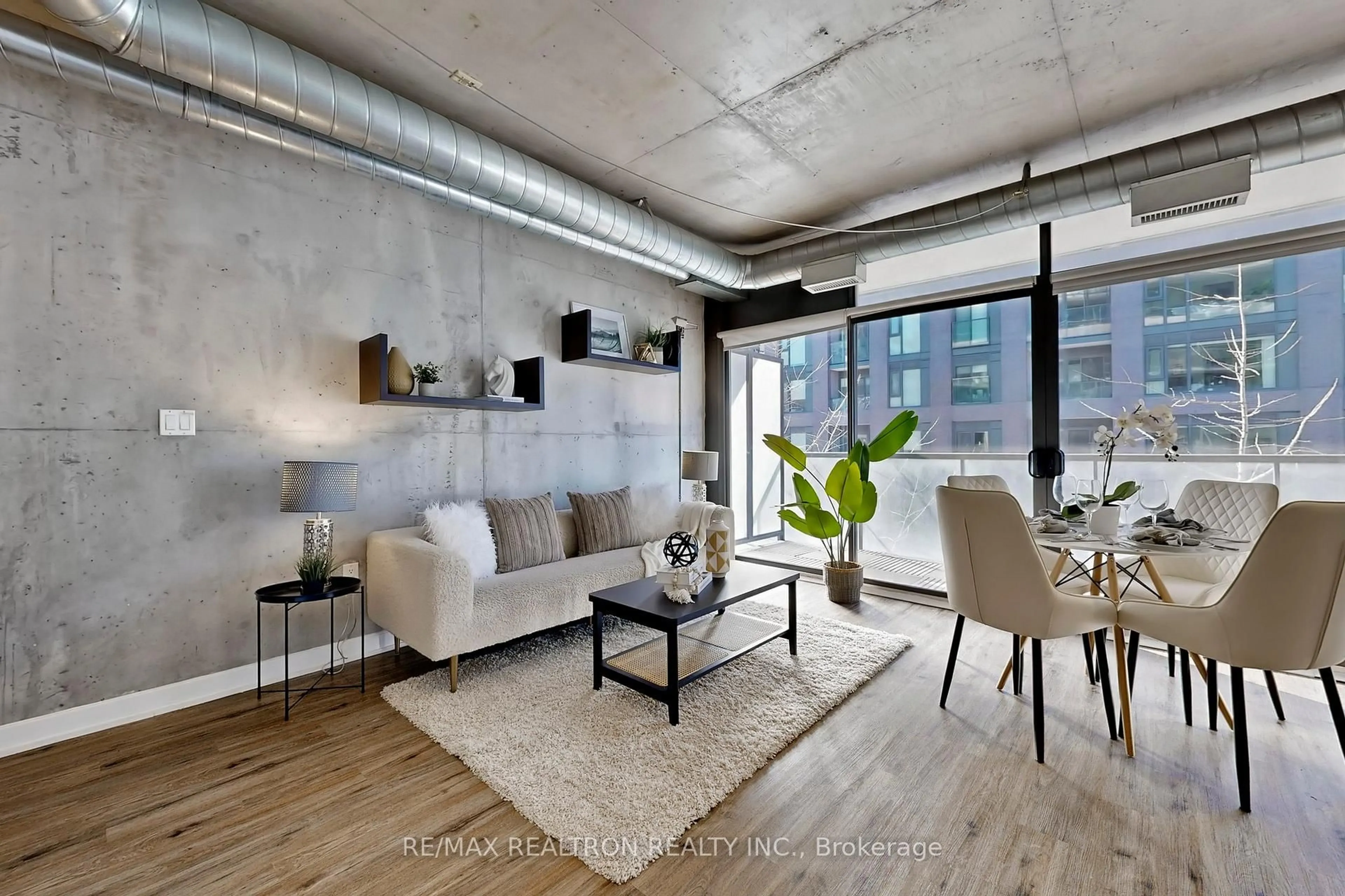 Living room with furniture, cement floor for 533 Richmond St #408, Toronto Ontario M5V 3Y1