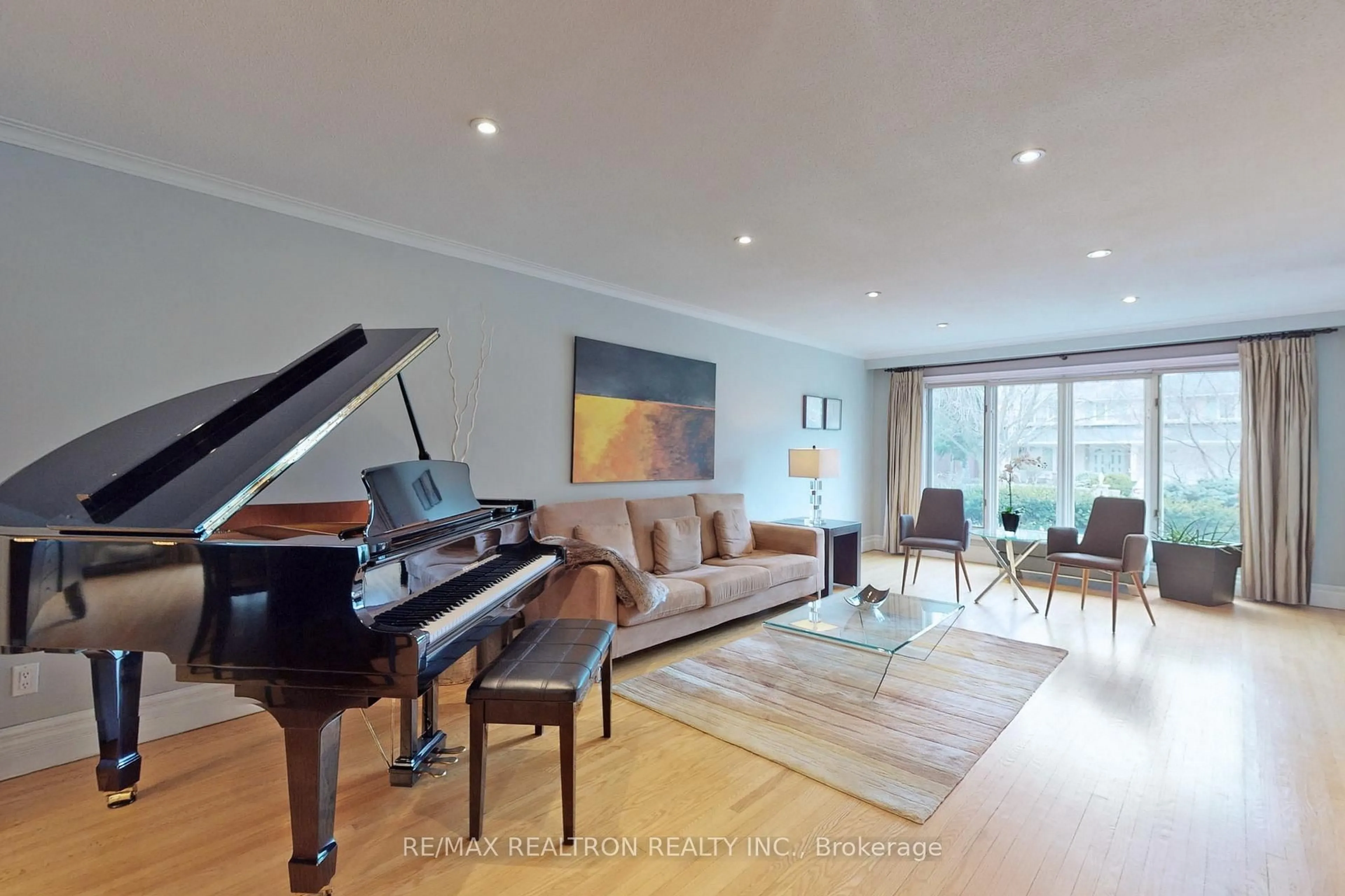 Living room with furniture, wood/laminate floor for 38 Apollo Dr, Toronto Ontario M3B 2G8