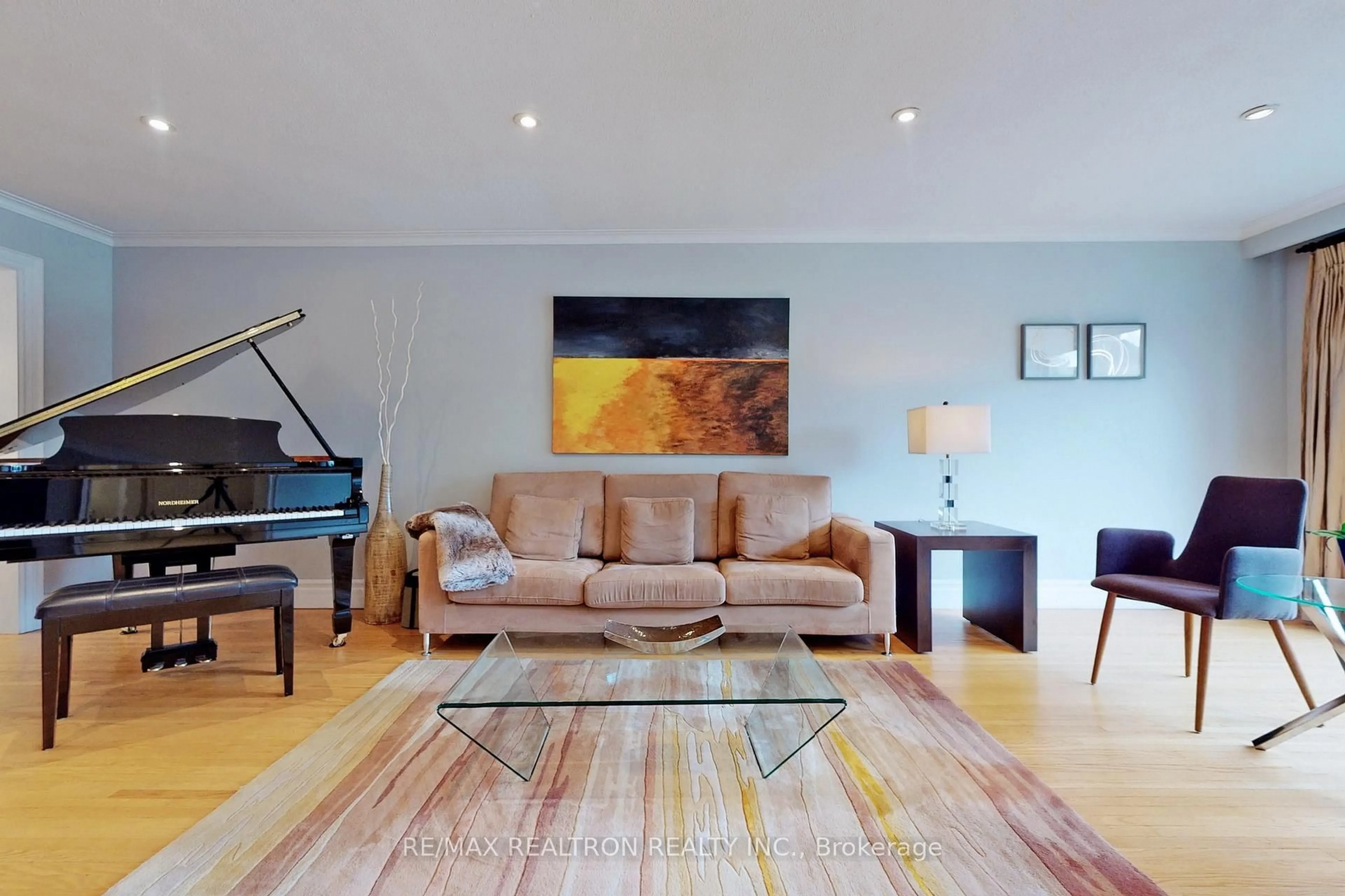 Living room with furniture, wood/laminate floor for 38 Apollo Dr, Toronto Ontario M3B 2G8