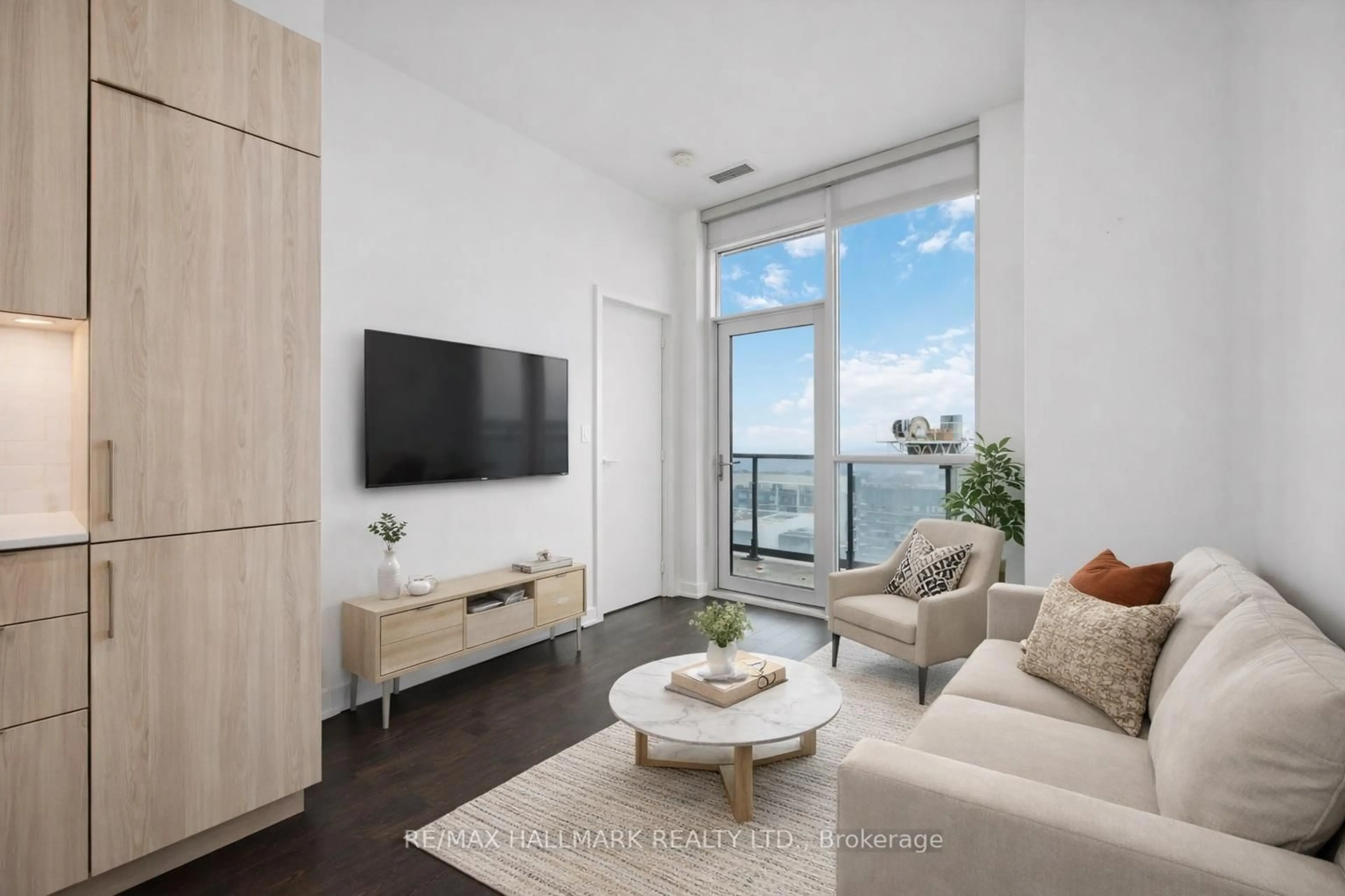 Living room with furniture, wood/laminate floor for 50 Ordnance St #3203, Toronto Ontario M6K 0C9