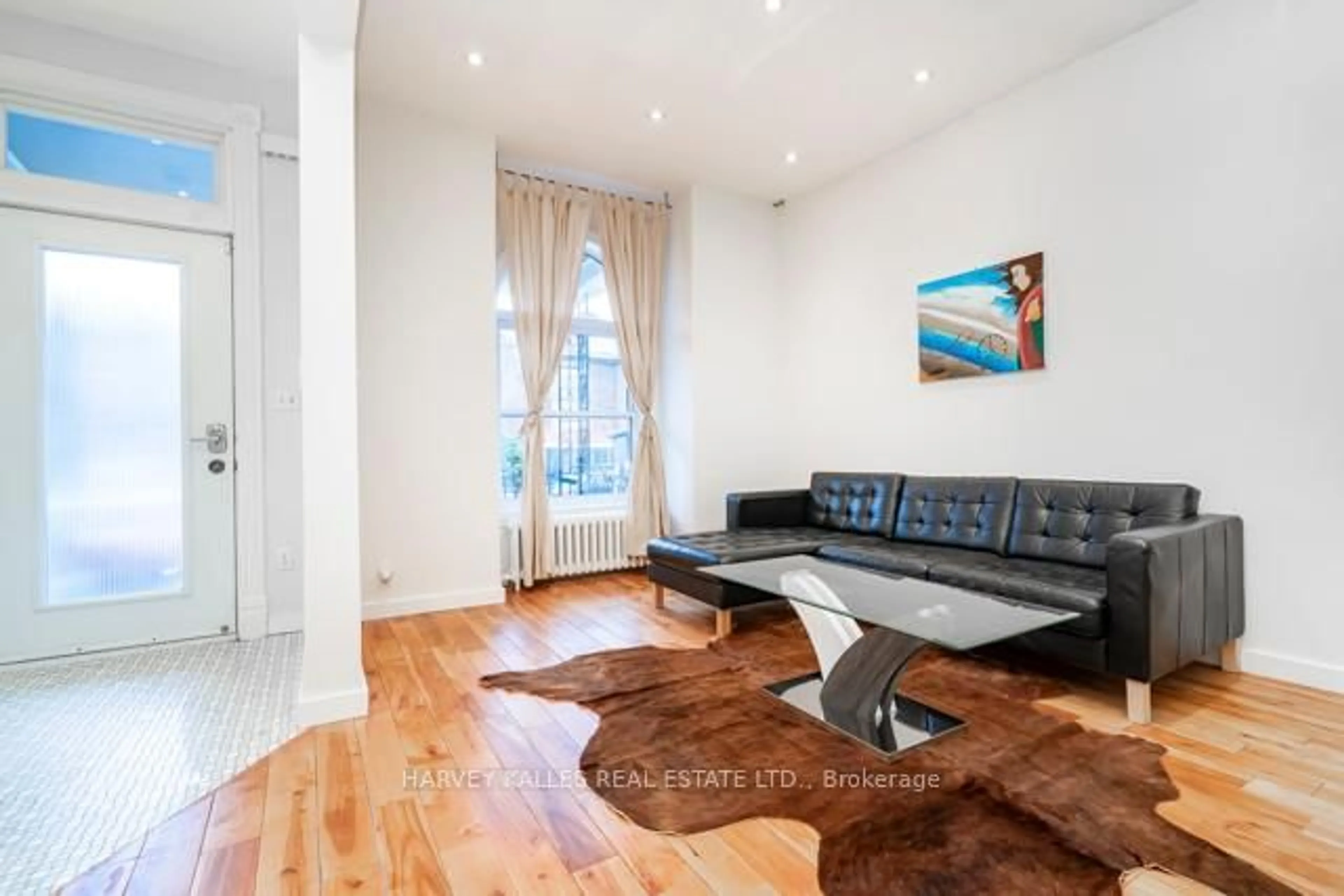 Living room with furniture, wood/laminate floor for 178 Manning Ave, Toronto Ontario M6J 2K5