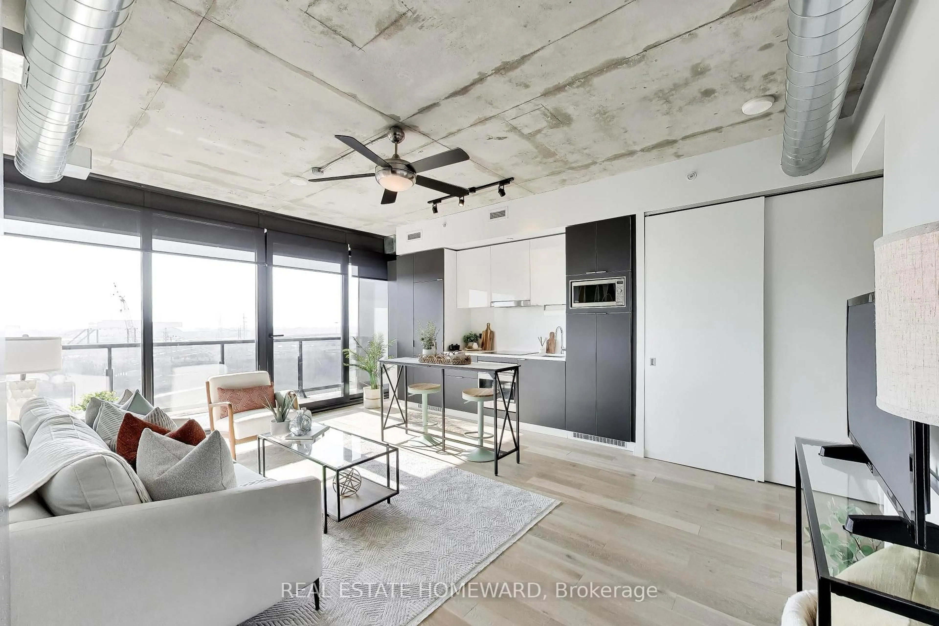 Open concept kitchen, cement floor for 170 Bayview Ave #1011, Toronto Ontario M5A 0M4