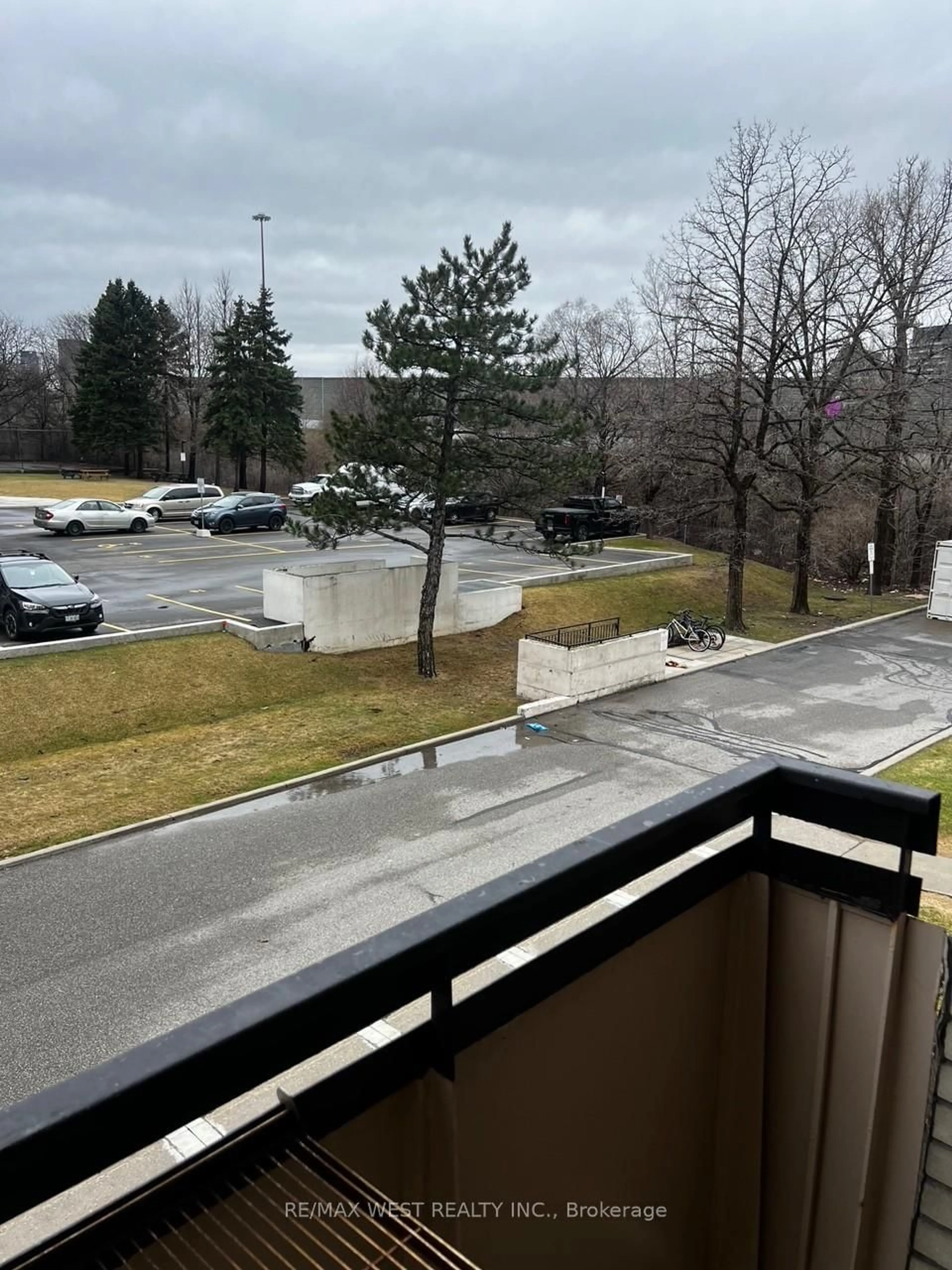 Patio, city buildings view from balcony for 130 Neptune Dr #202, Toronto Ontario M6A 1X5