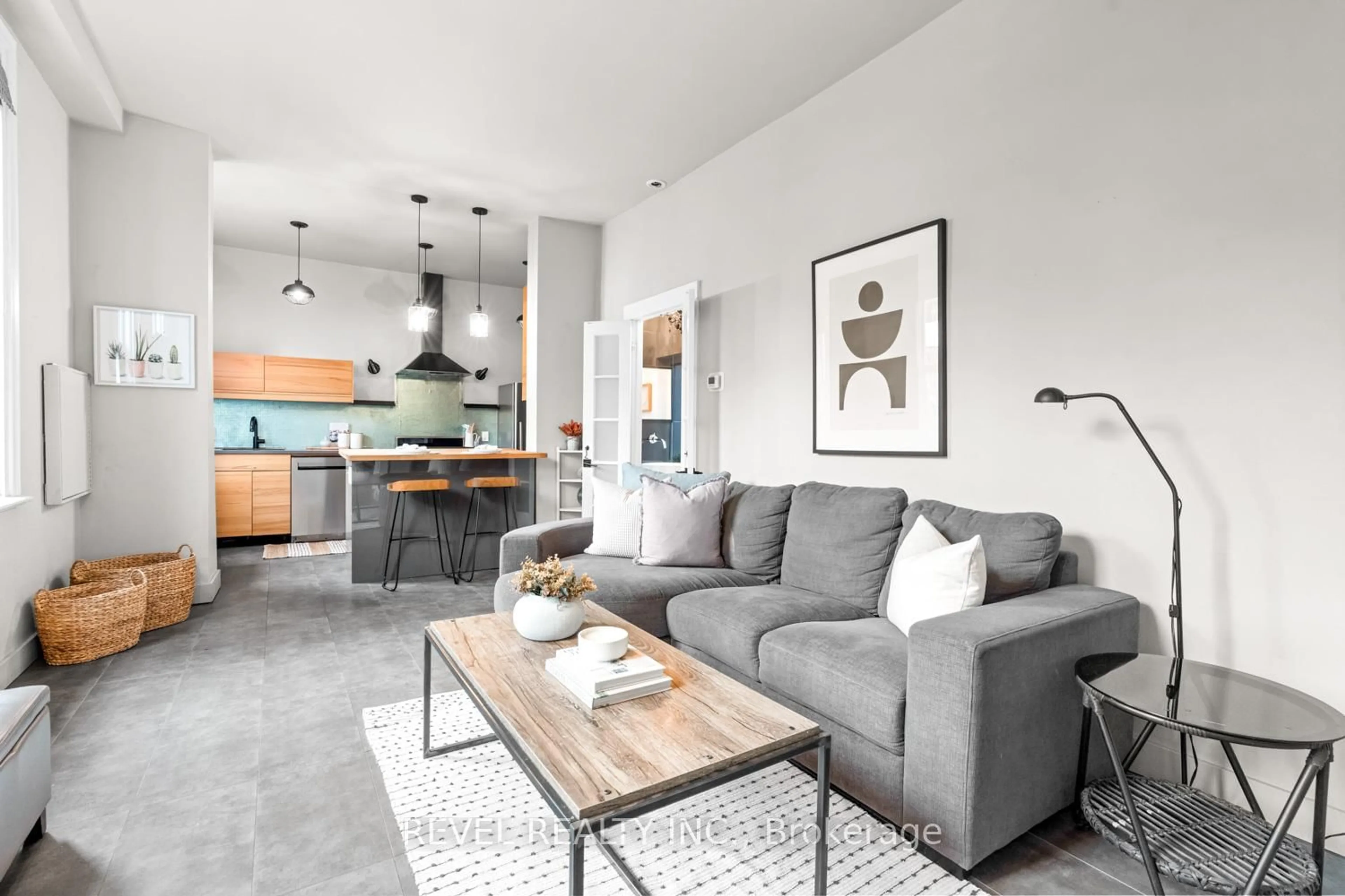 Living room with furniture, cement floor for 89 Foxley St, Toronto Ontario M6J 1P9