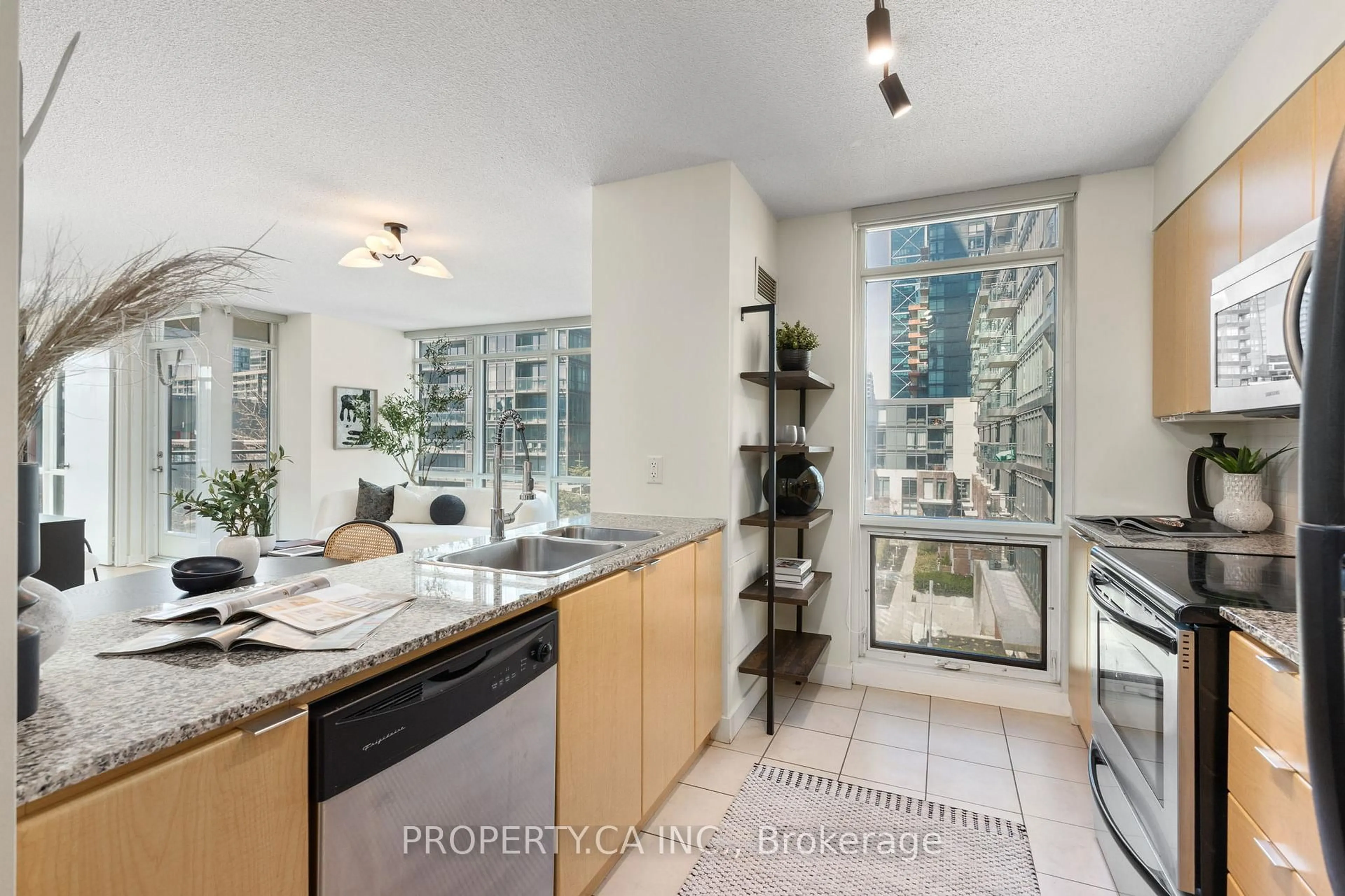 Kitchen with laundary machines, ceramic/tile floor for 11 Brunel Crt #503, Toronto Ontario M5V 3Y3