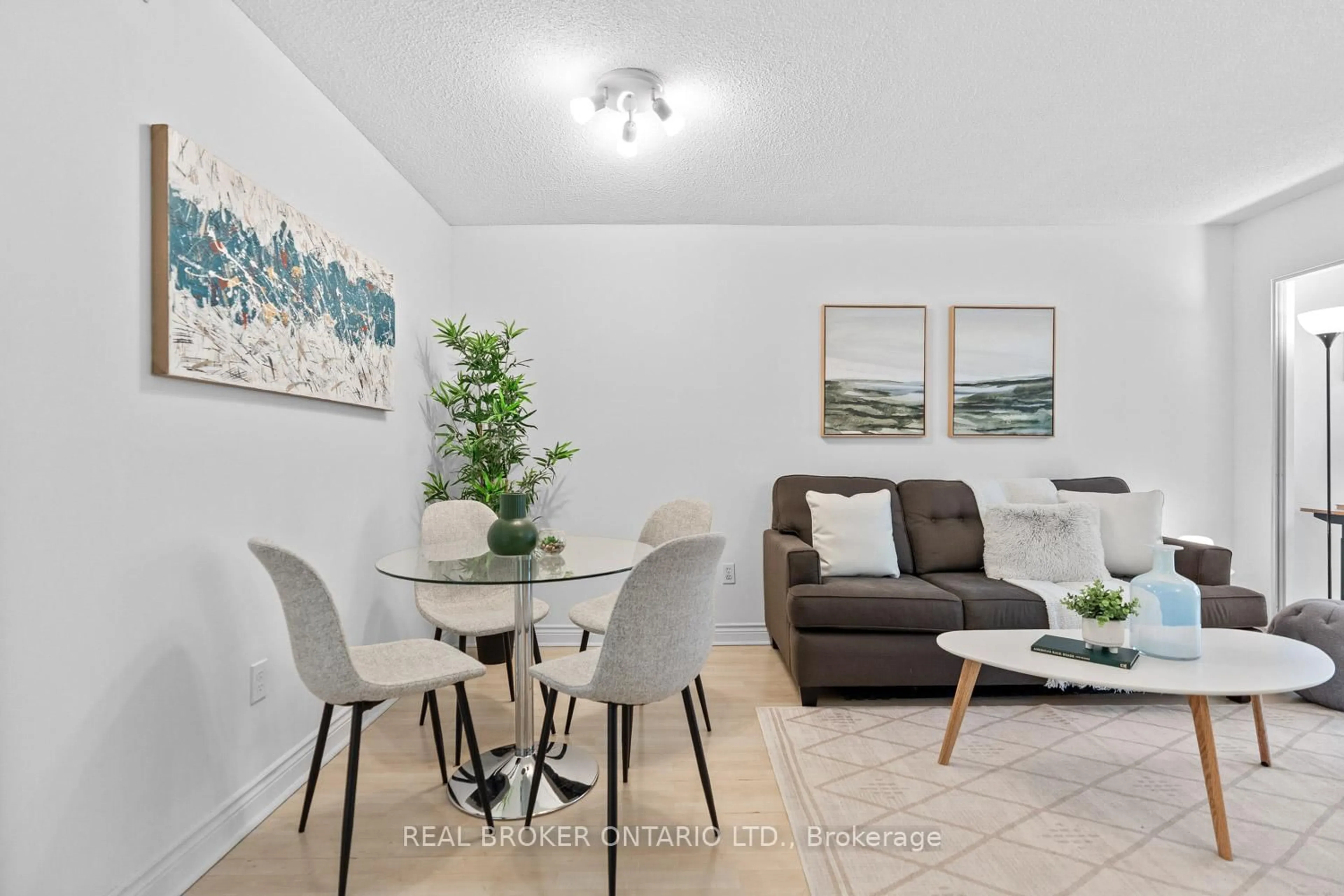 Living room with furniture, wood/laminate floor for 65 Scadding Ave #223, Toronto Ontario M5A 4L1