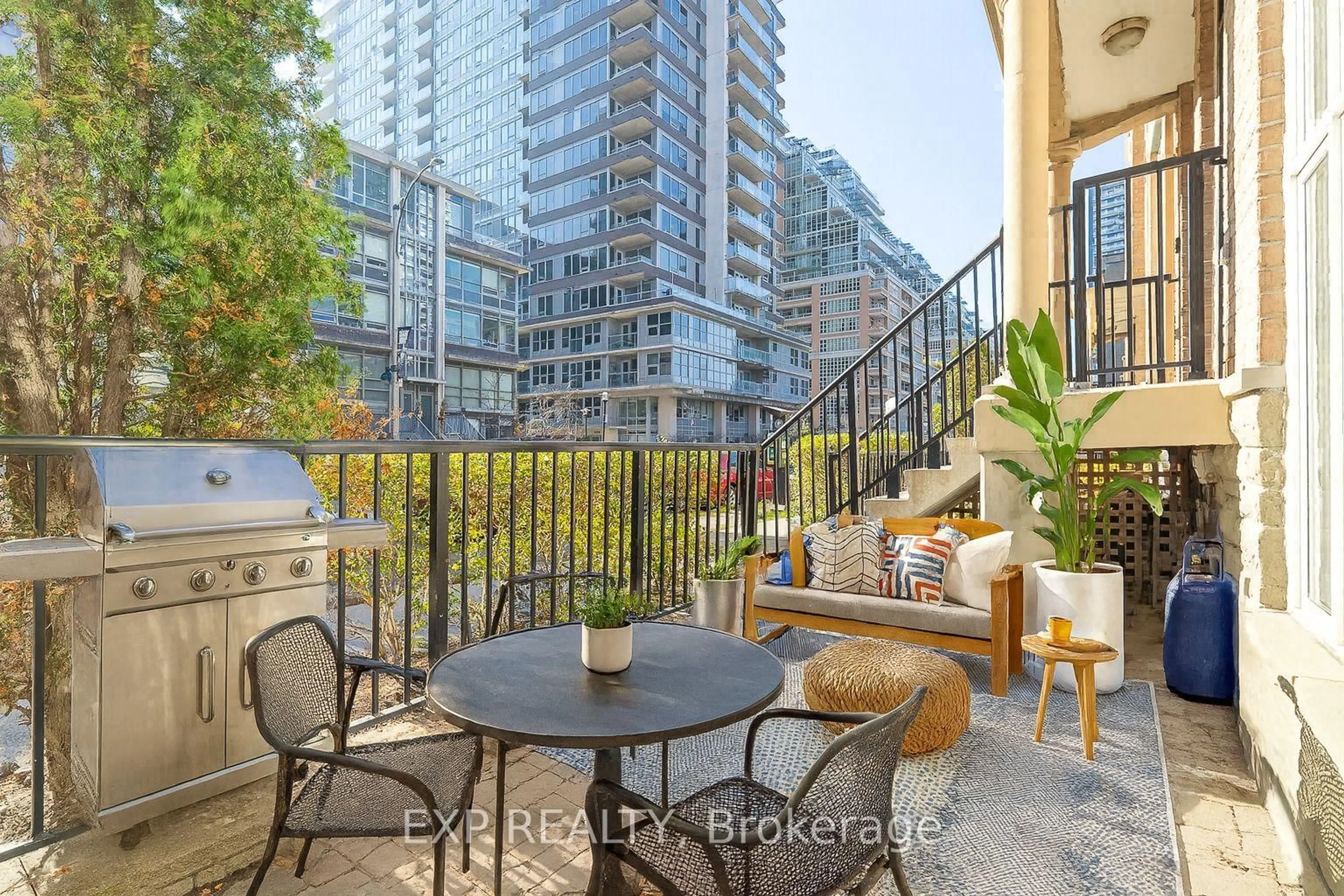 Patio, city buildings view from balcony for 50 East Liberty St #1111, Toronto Ontario M6K 3P3