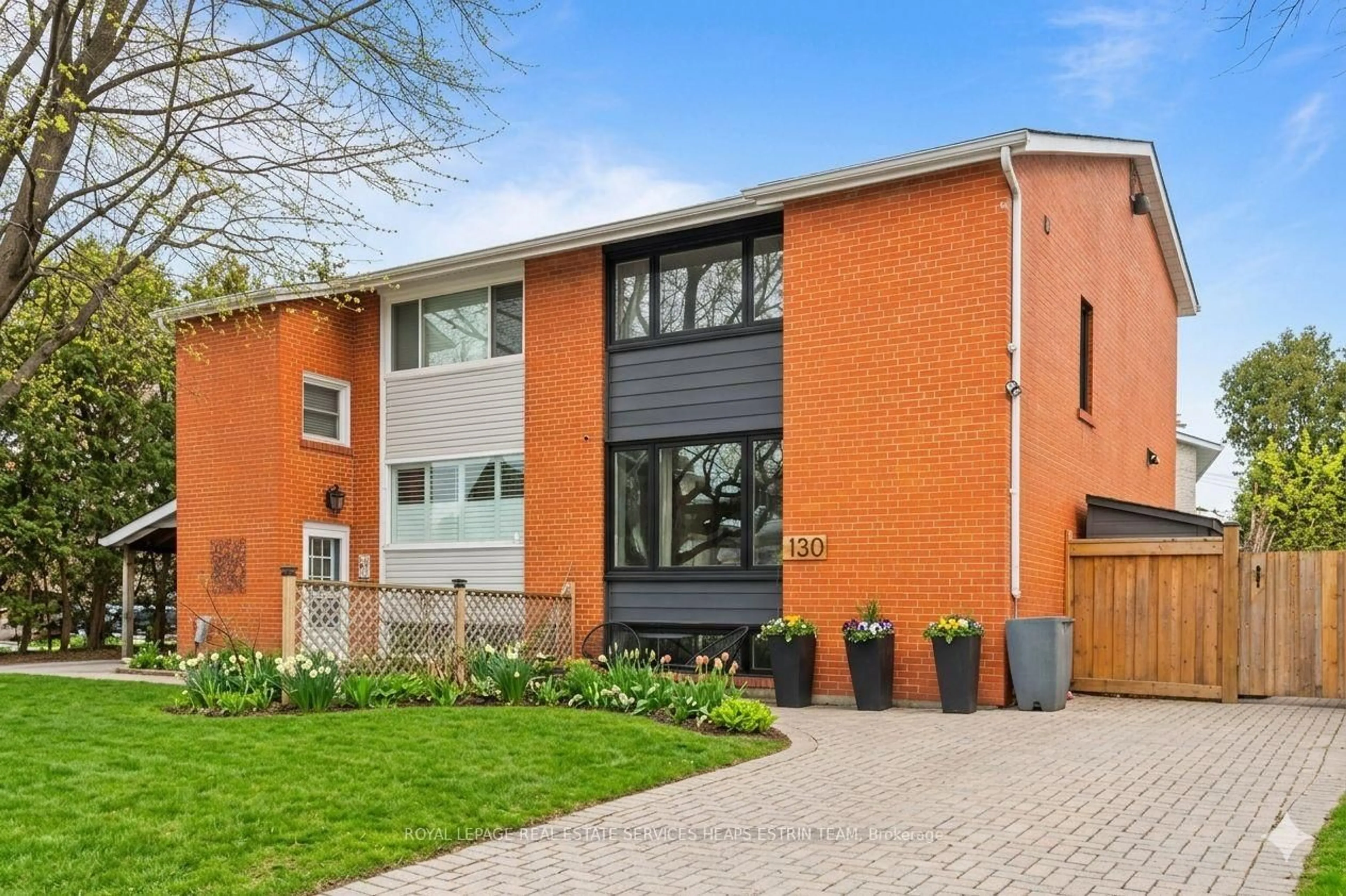 Home with brick exterior material, street for 130 Barber Greene Rd, Toronto Ontario M3C 2A5