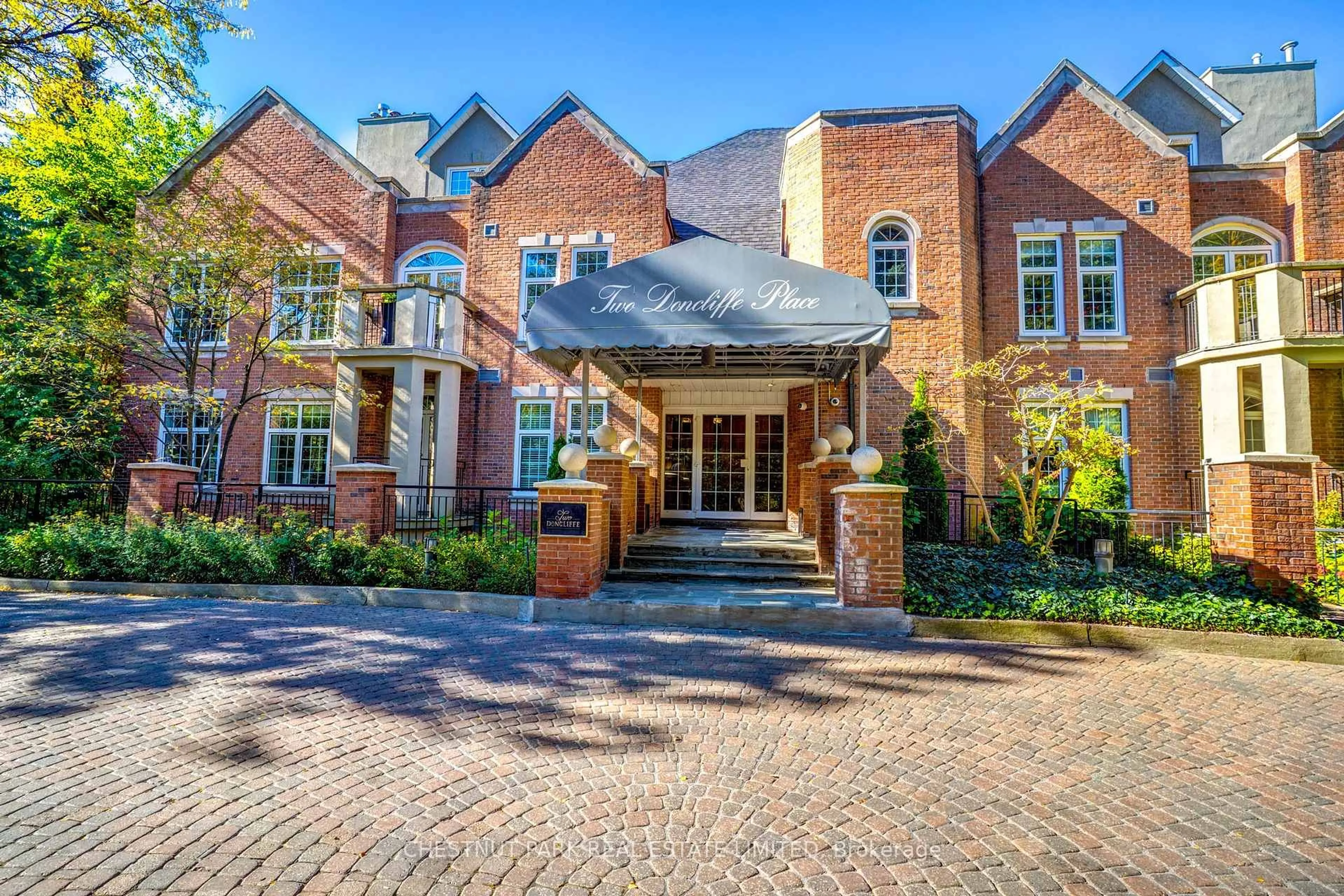 Home with brick exterior material, street for 2 Doncliffe Pl #102B, Toronto Ontario M4N 2R1