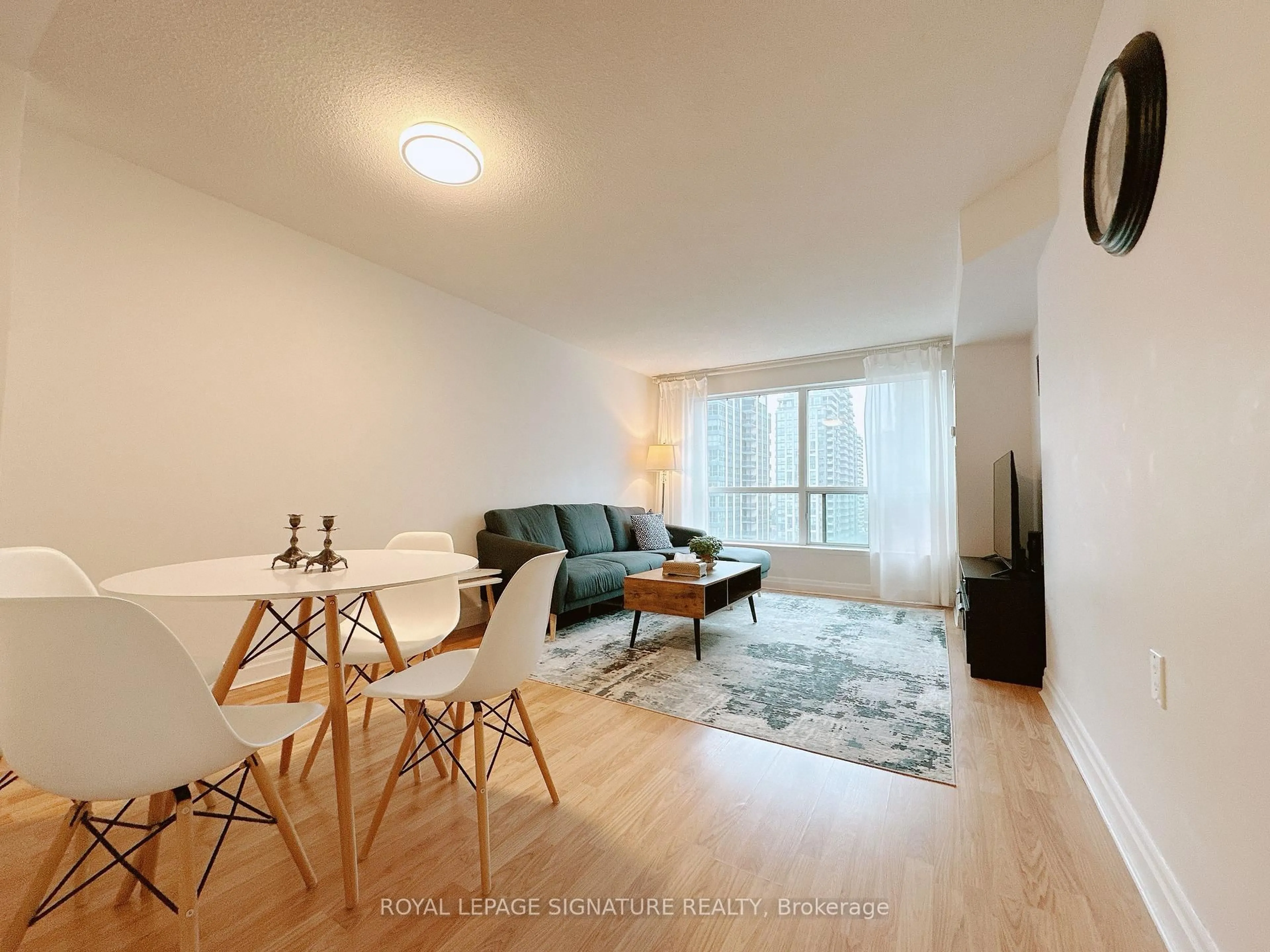 Living room with furniture, wood/laminate floor for 21 Hillcrest Ave #905, Toronto Ontario M2N 7K2