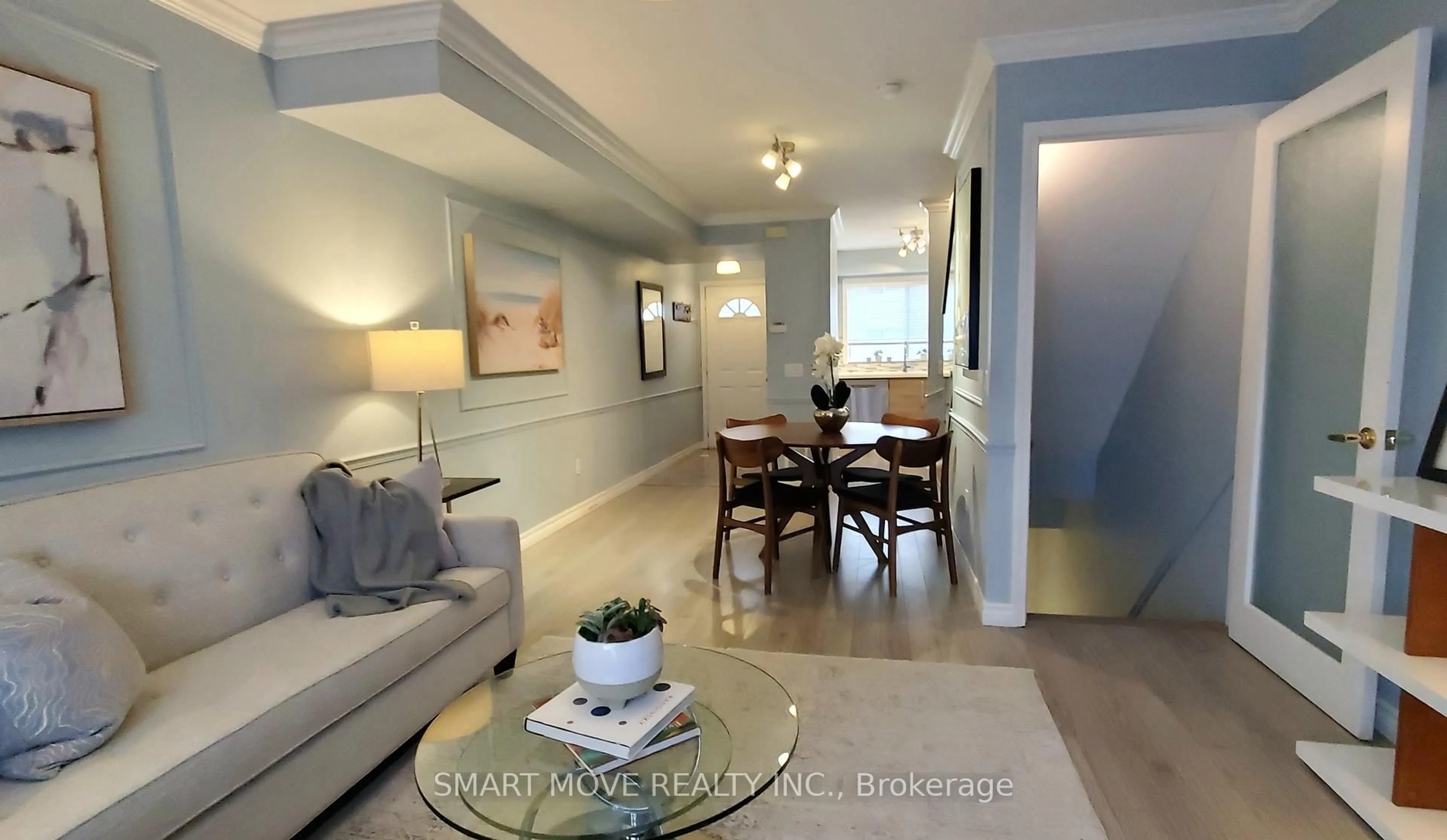 Living room with furniture, wood/laminate floor for 21 Replin Rd #TH 25, Toronto Ontario M6A 2M8