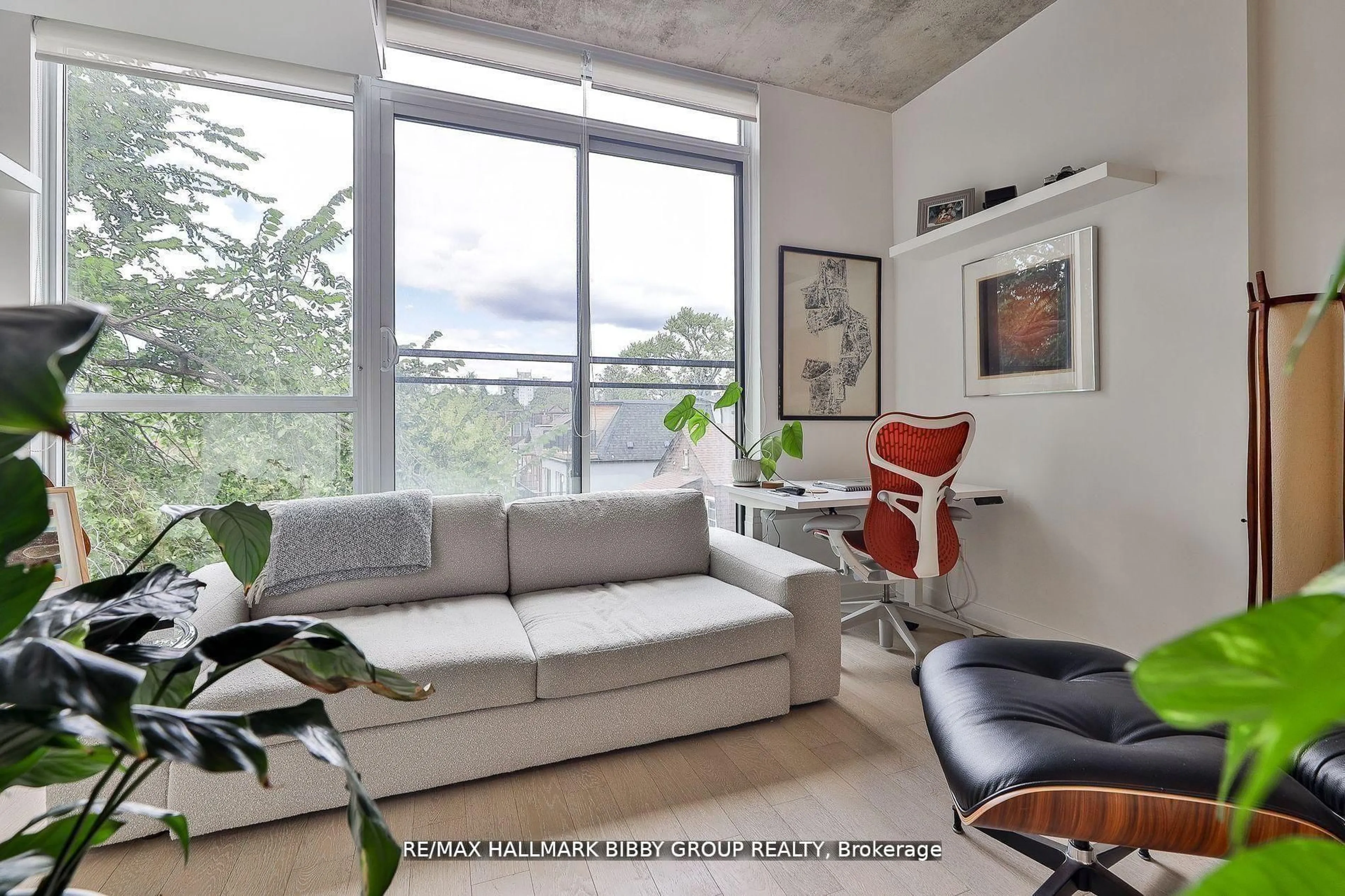 Living room with furniture, cement floor for 130 Rusholme Rd #309, Toronto Ontario M6H 1A7