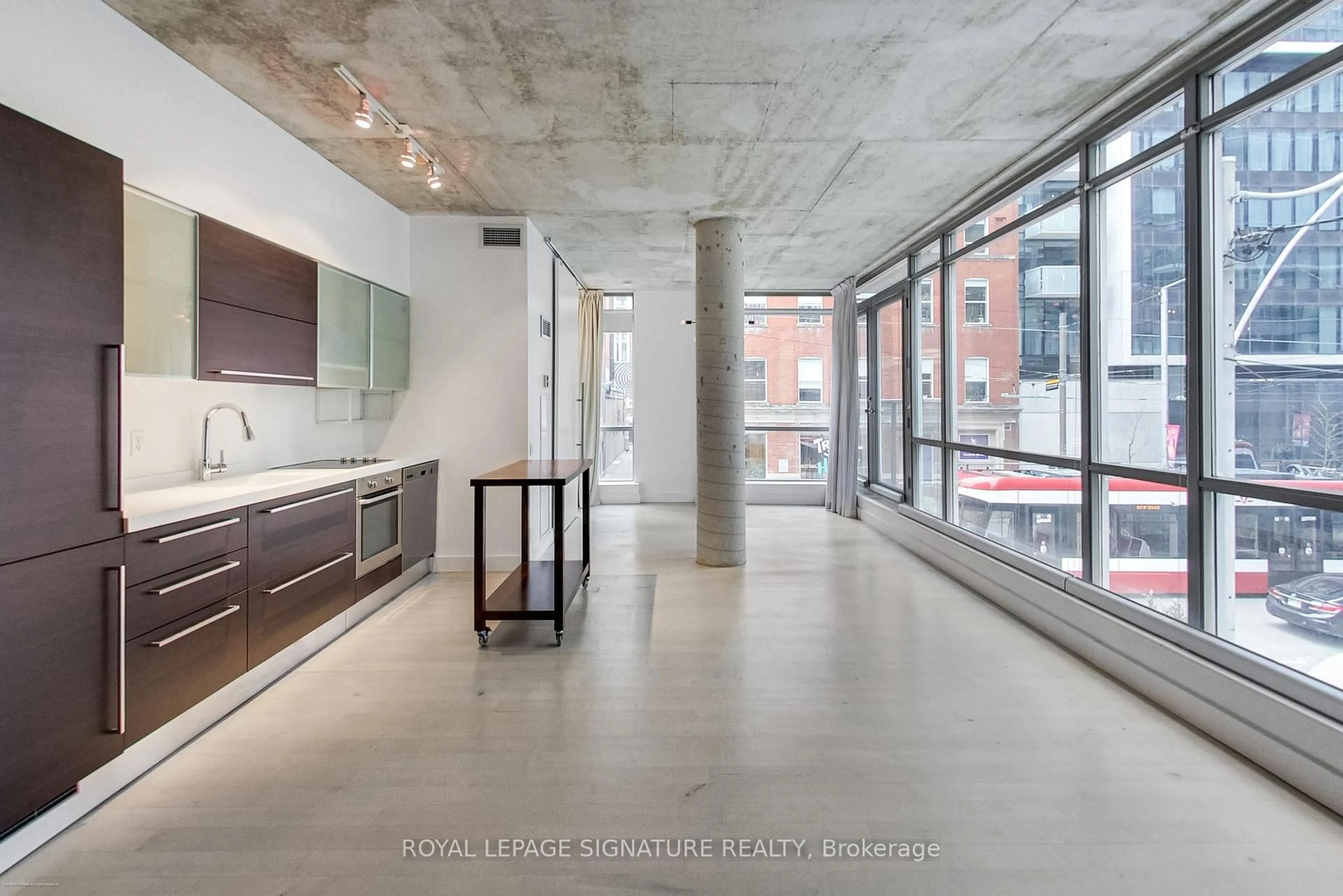 Open concept kitchen, cement floor for 36 Charlotte St #204, Toronto Ontario M5V 3P7