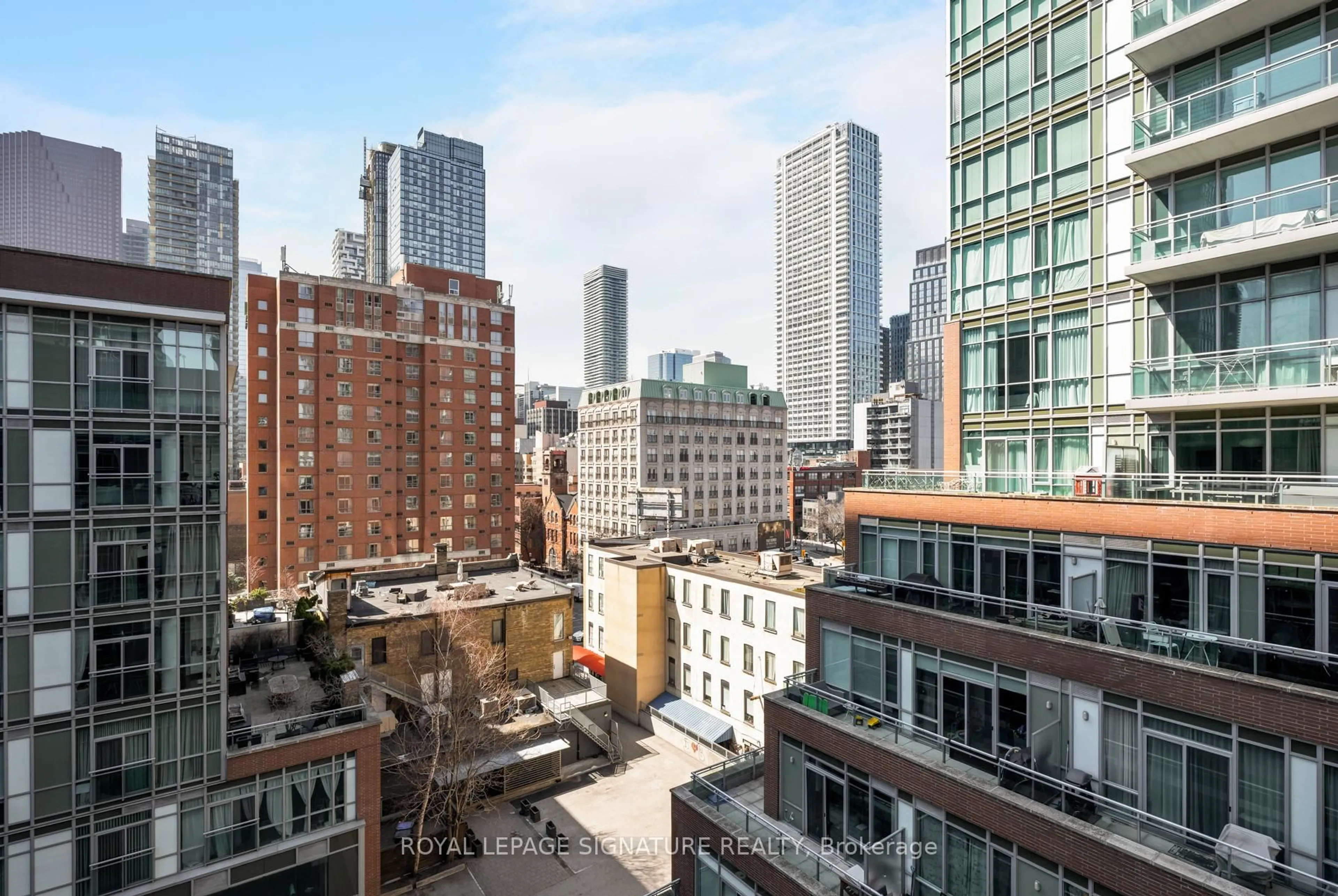 Patio, city buildings view from balcony for 112 George St #S708, Toronto Ontario M5A 2M5