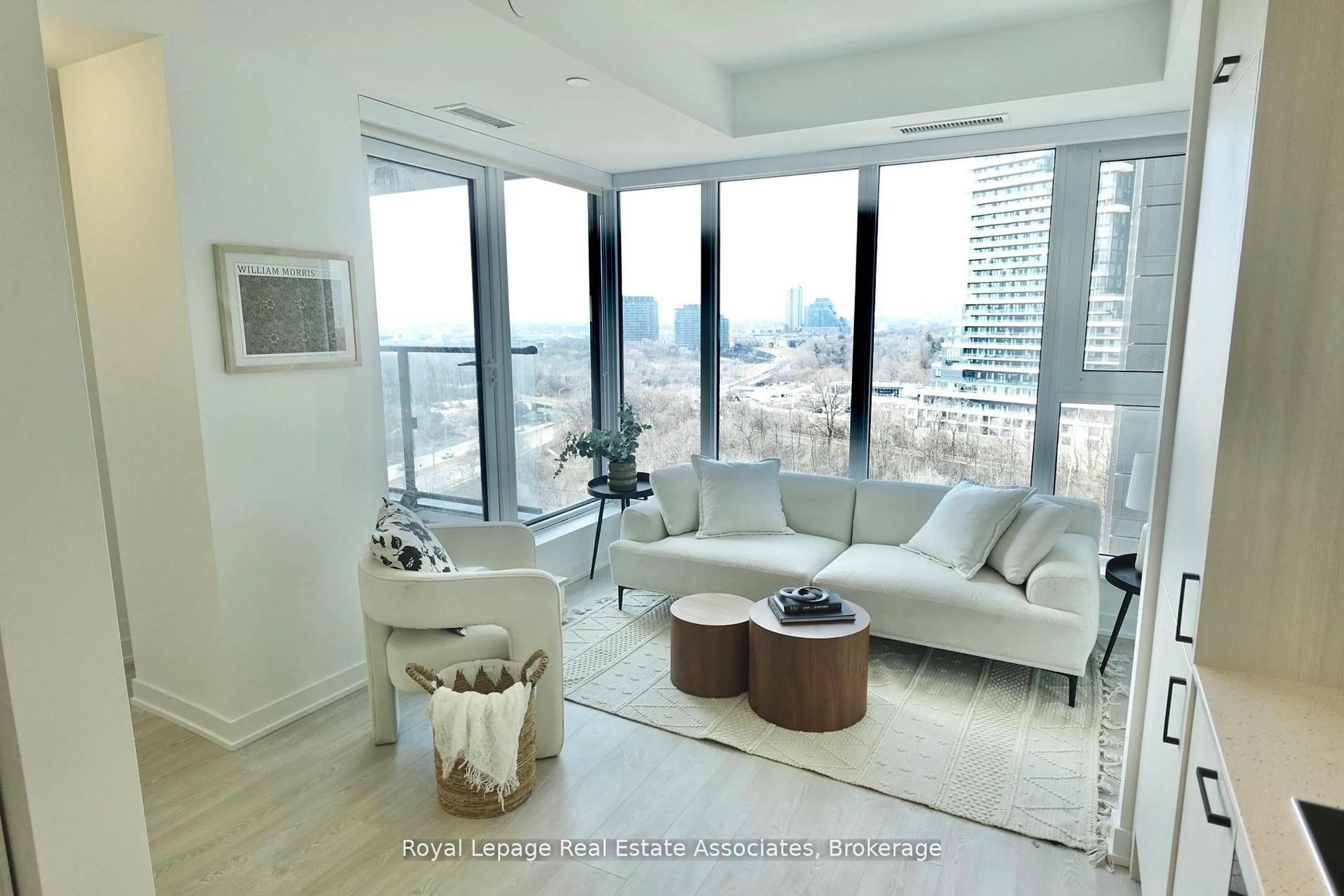 Living room with furniture, wood/laminate floor for 1 Quarrington Lane #1004, Toronto Ontario M3C 0S4