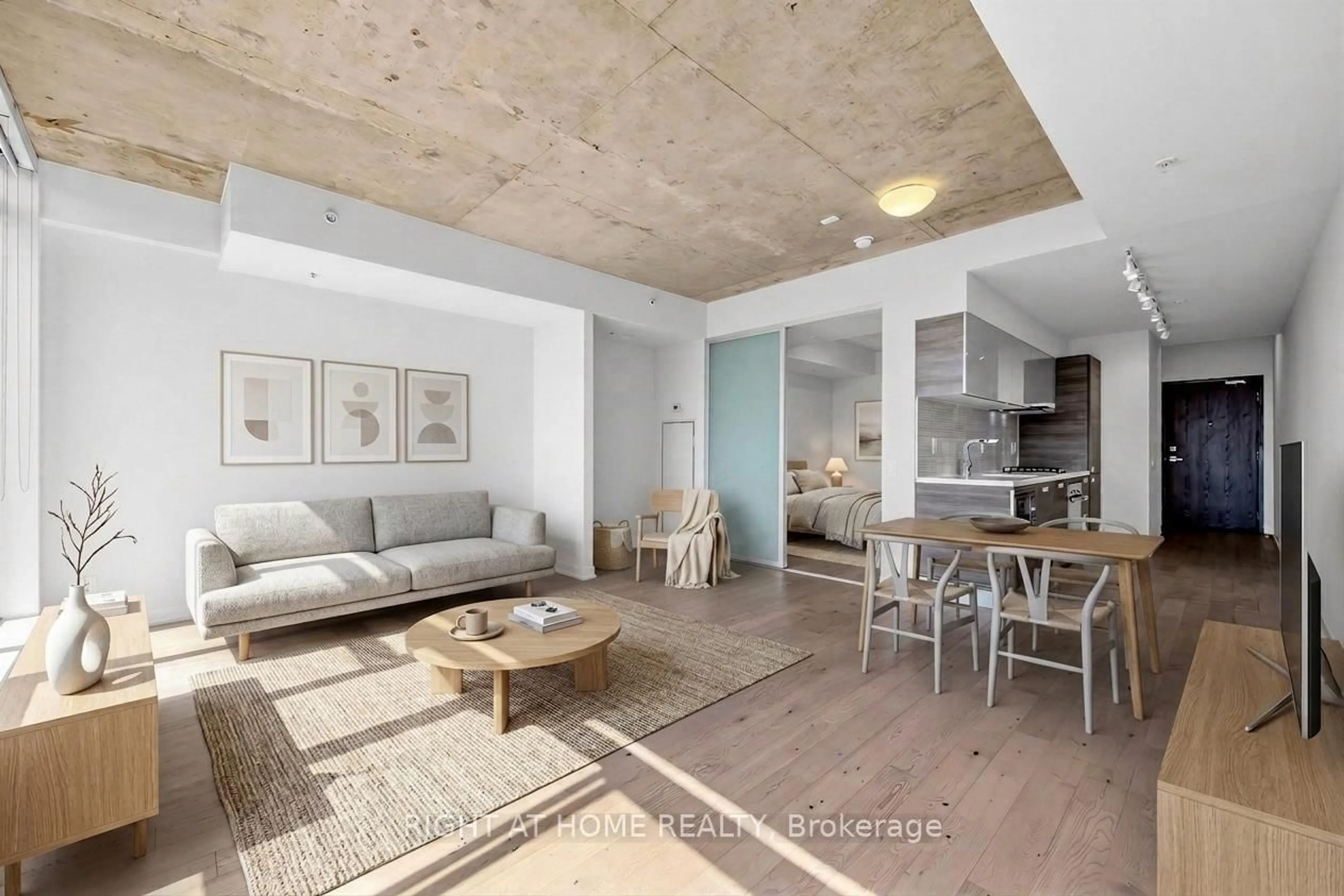 Living room with furniture, cement floor for 1239 Dundas St #302, Toronto Ontario M6J 0E8