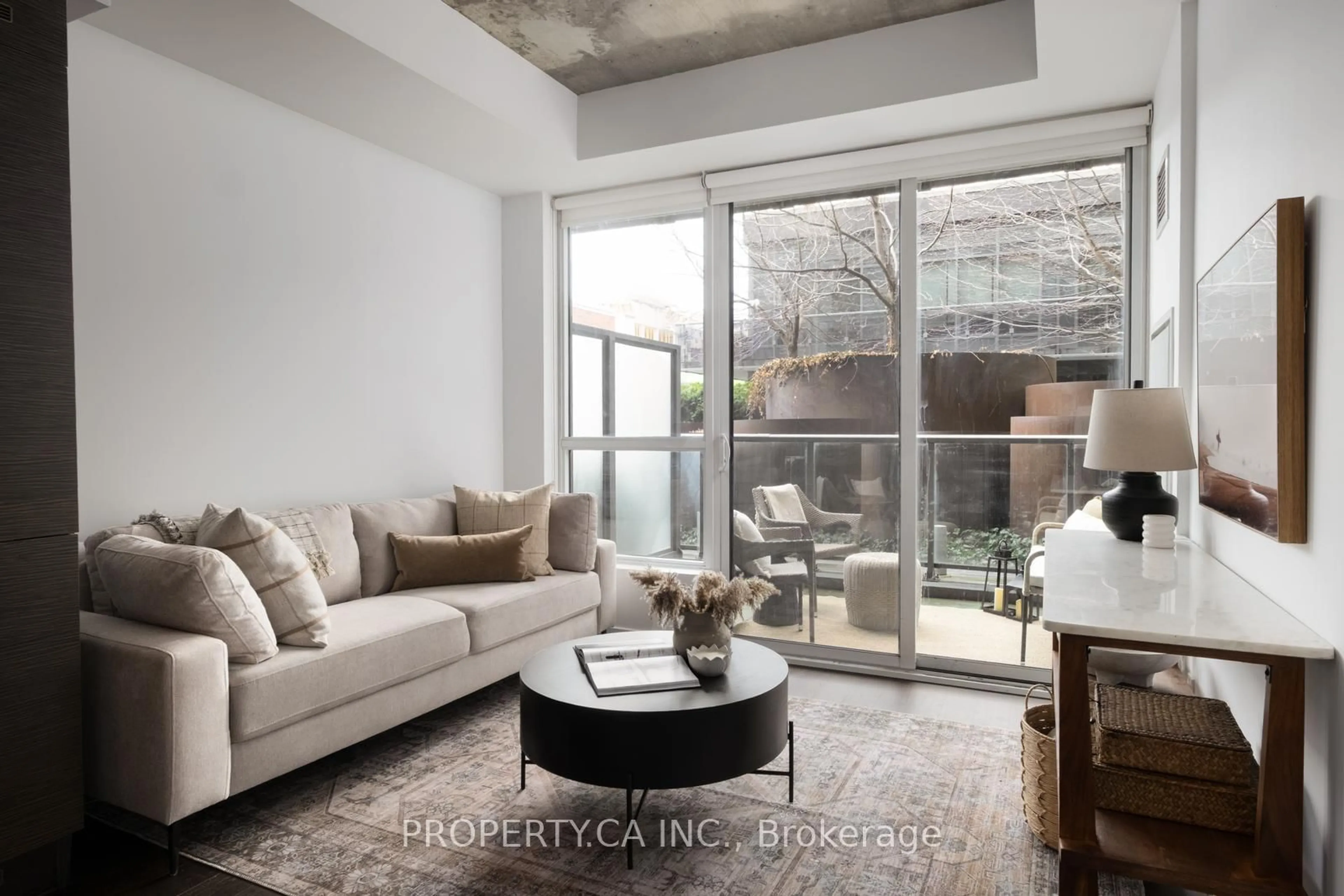 Living room with furniture, cement floor for 1030 King St #344, Toronto Ontario M6K 3N3