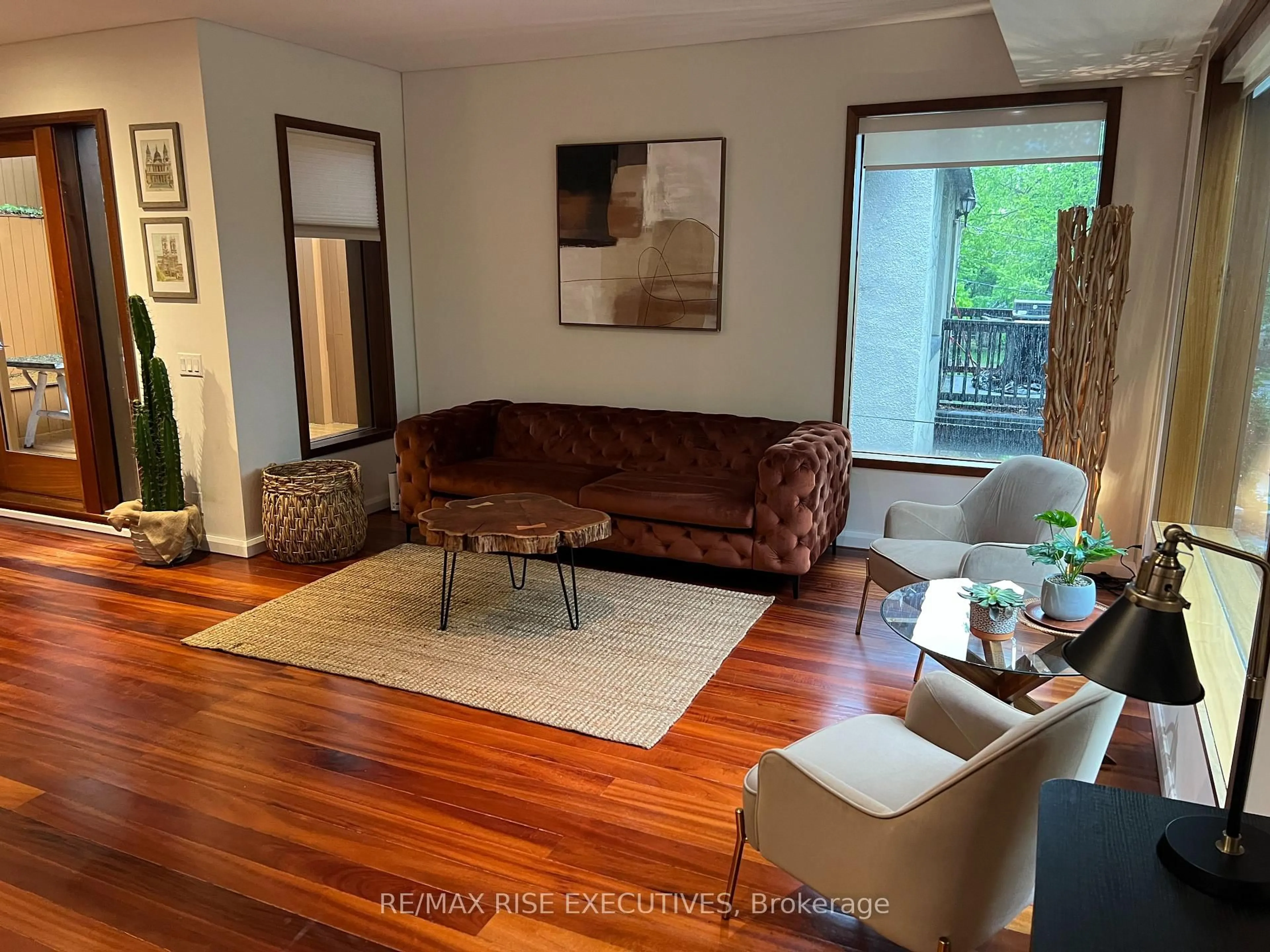 Living room with furniture, wood/laminate floor for 32 Regal Rd, Toronto Ontario M6H 2J7