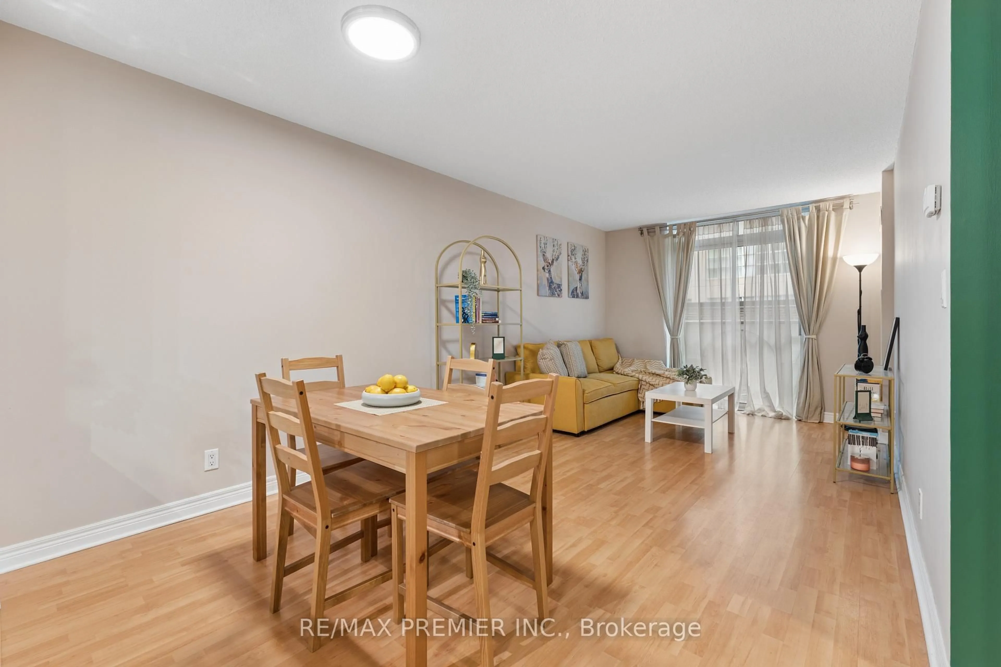 Living room with furniture, wood/laminate floor for 212 Eglinton Ave #307, Toronto Ontario M4P 0A3