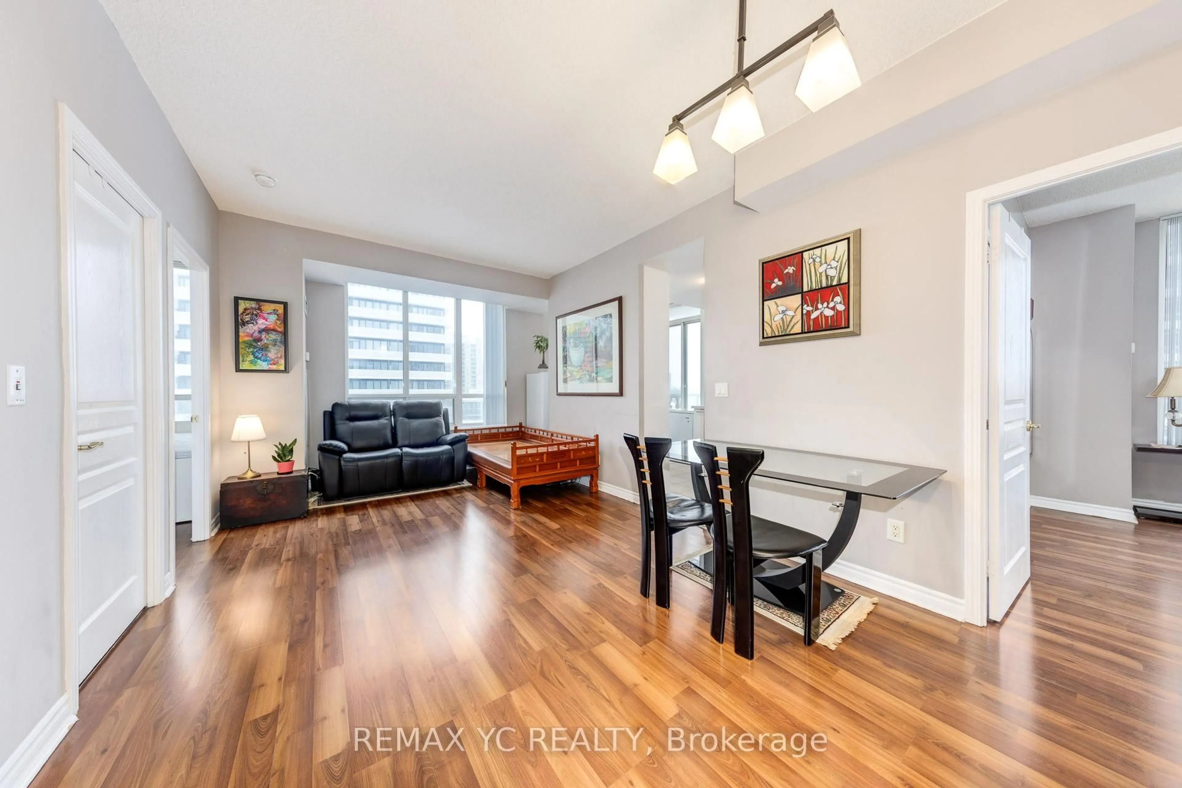 Living room with furniture, wood/laminate floor for 28 Byng Ave #802, Toronto Ontario M2N 7H4