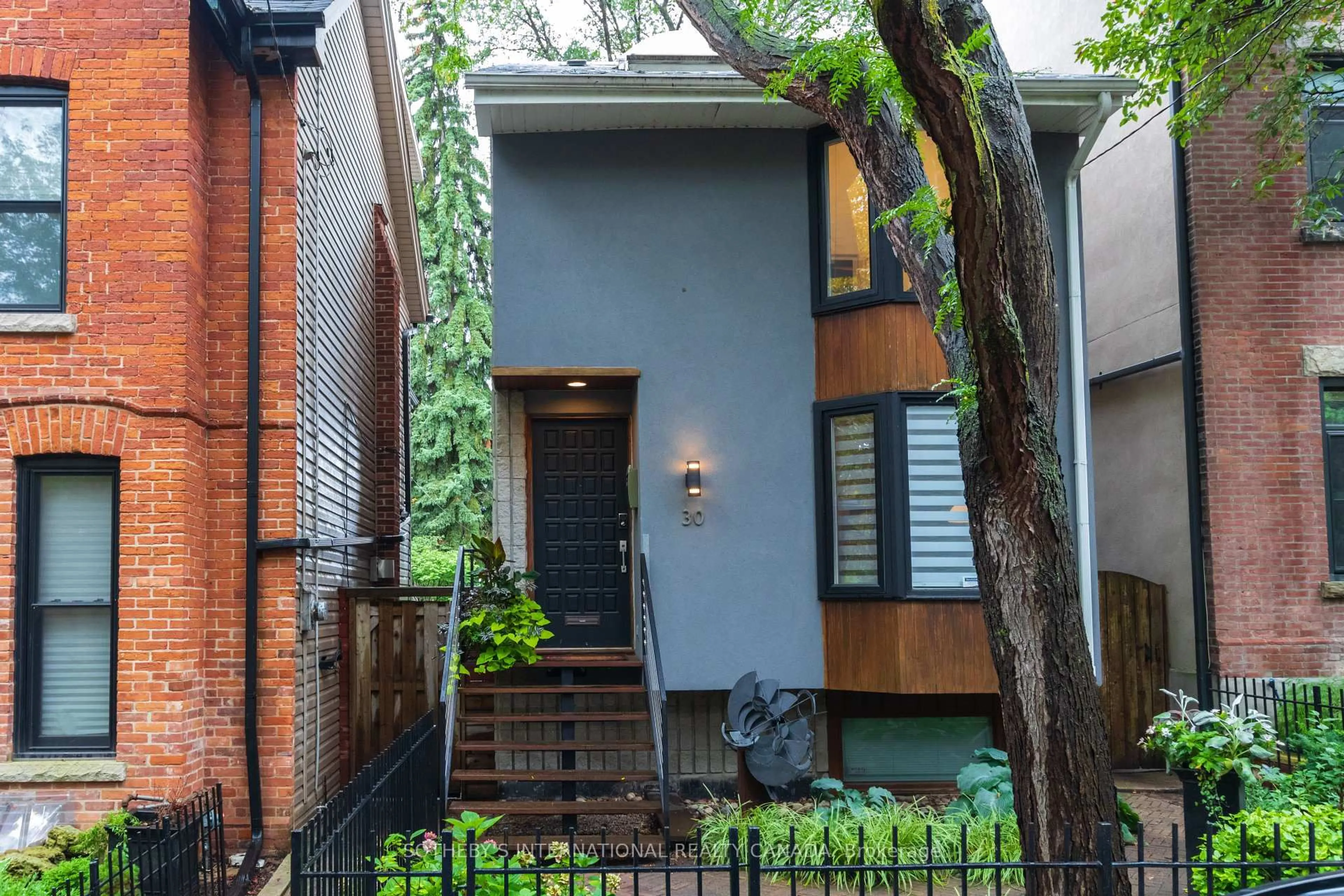 Home with brick exterior material, street for 30 Sword St, Toronto Ontario M5A 3N2