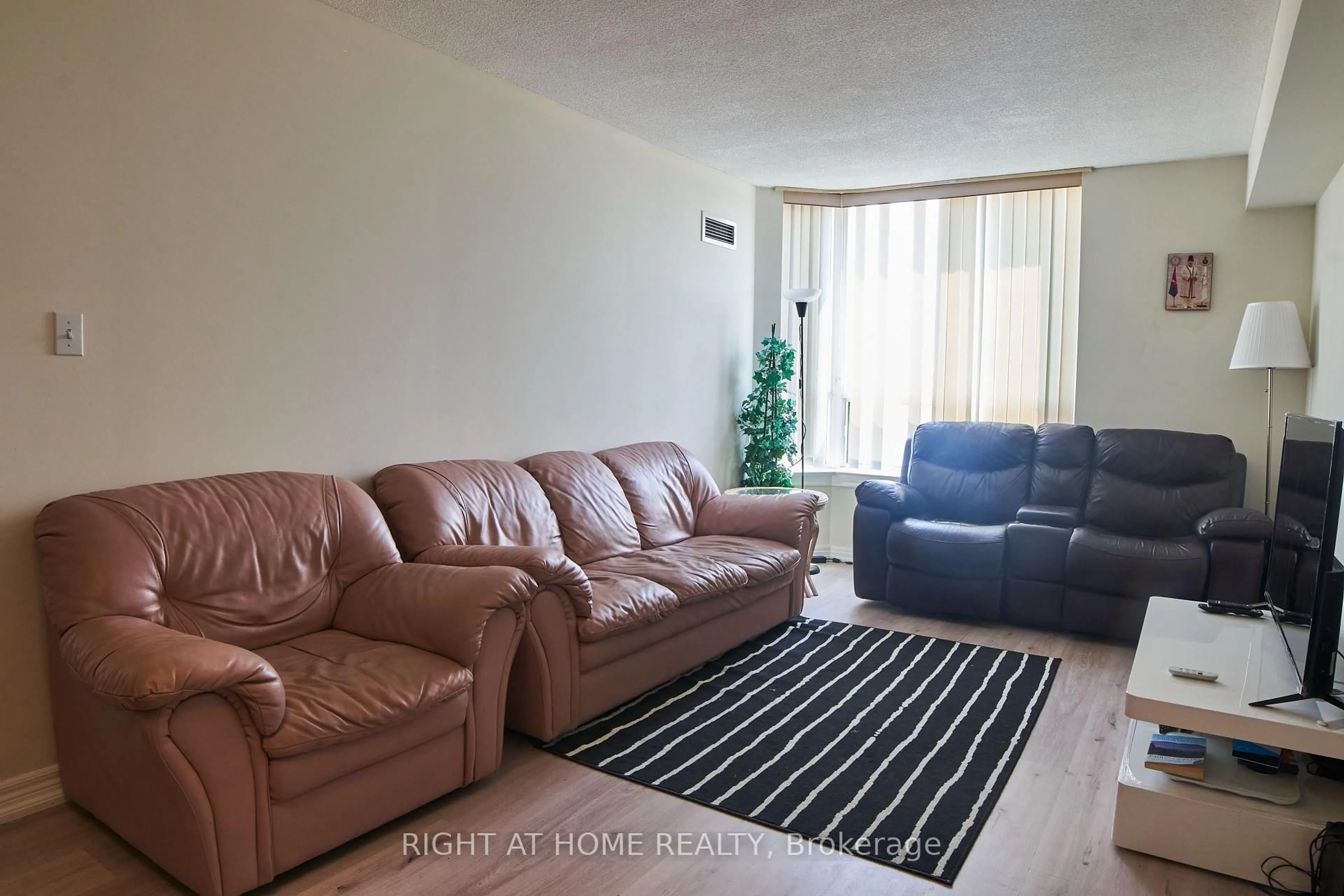 Living room with furniture, unknown for 1700 Eglinton Ave #609, Toronto Ontario M4A 2X4