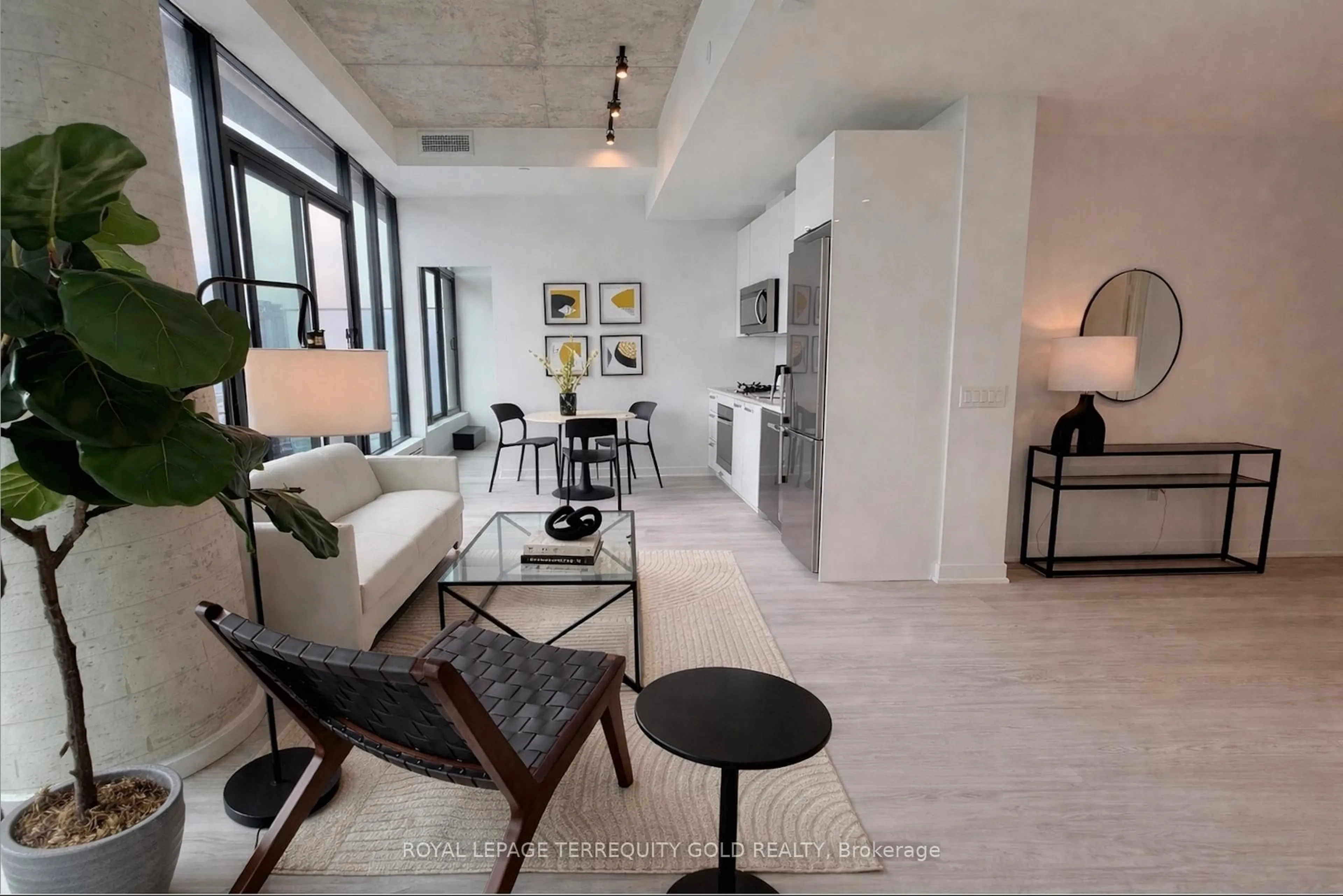 Living room with furniture, cement floor for 195 McCaul St #2003, Toronto Ontario M5T 0E5