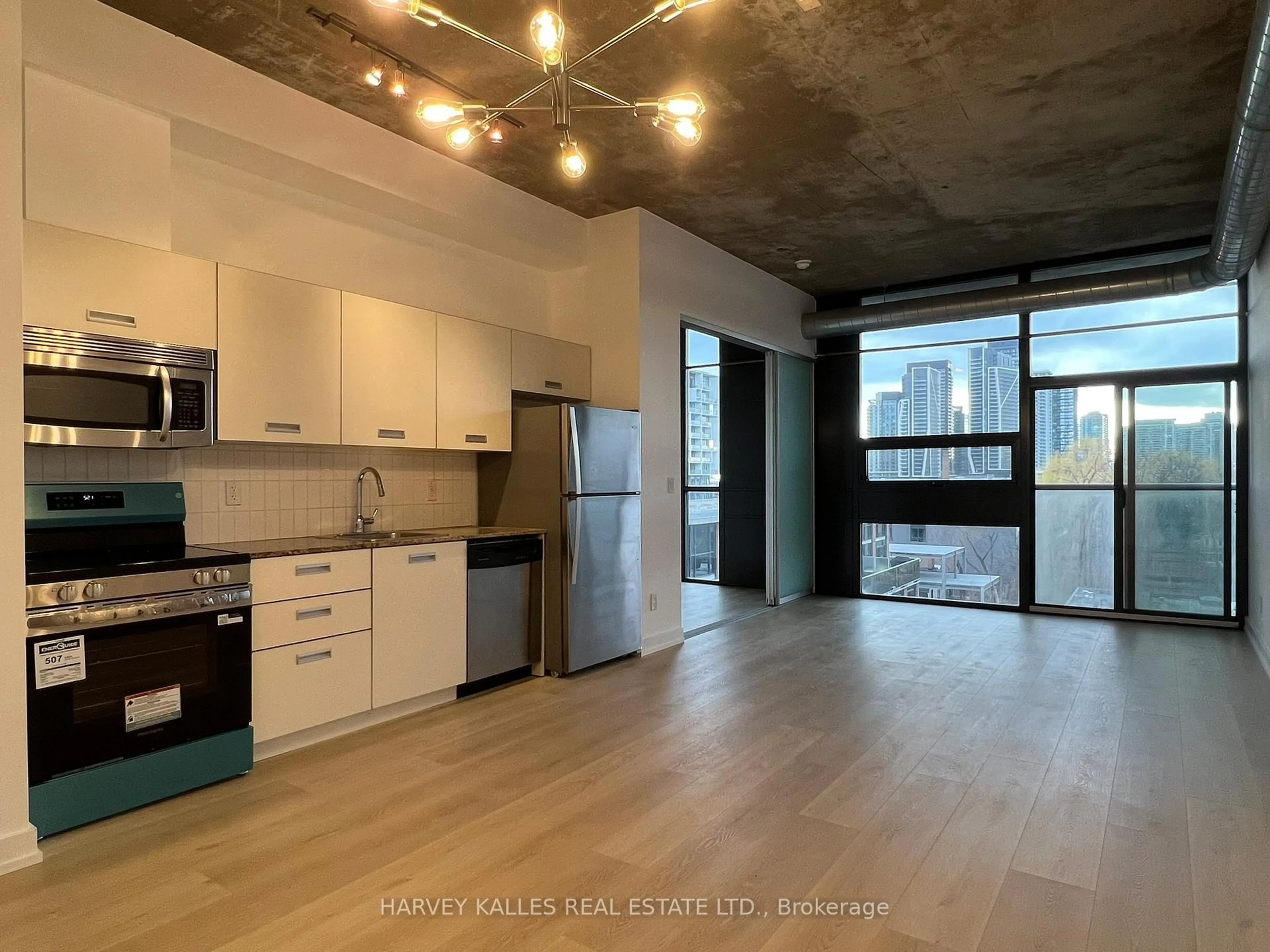 Open concept kitchen, cement floor for 60 Bathurst St #601, Toronto Ontario M5V 2P4