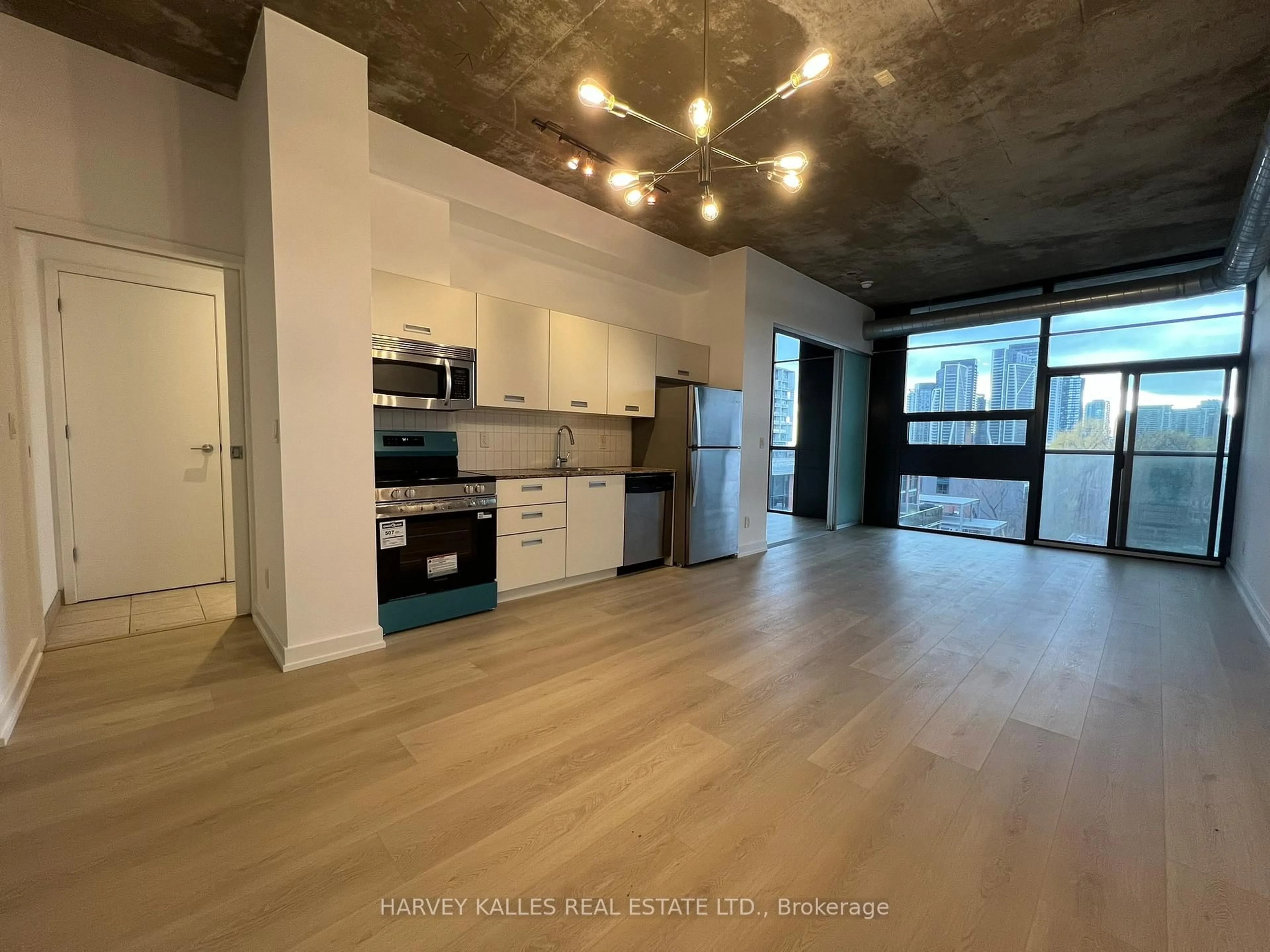 Open concept kitchen, cement floor for 60 Bathurst St #601, Toronto Ontario M5V 2P4