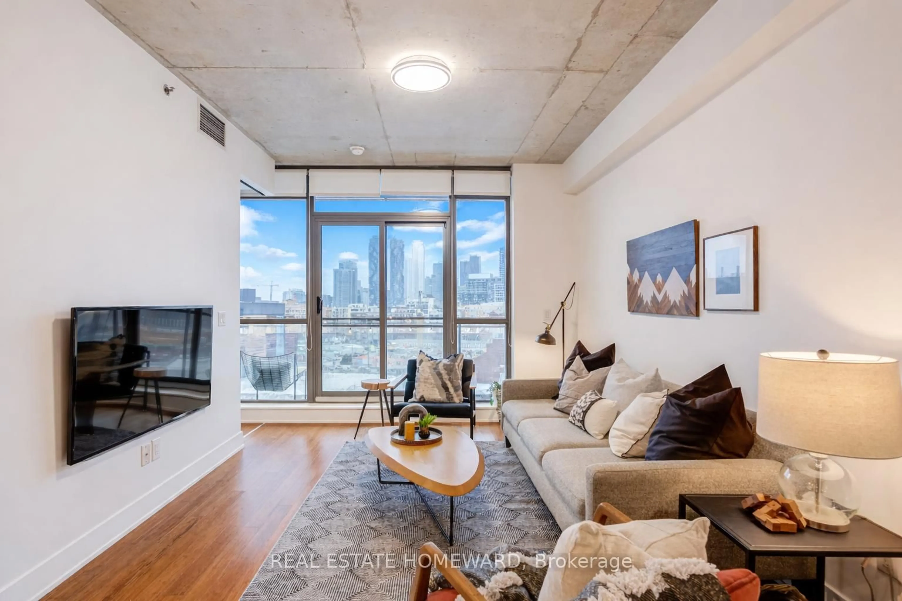 Living room with furniture, unknown for 90 Trinity St #709, Toronto Ontario M5A 0E4