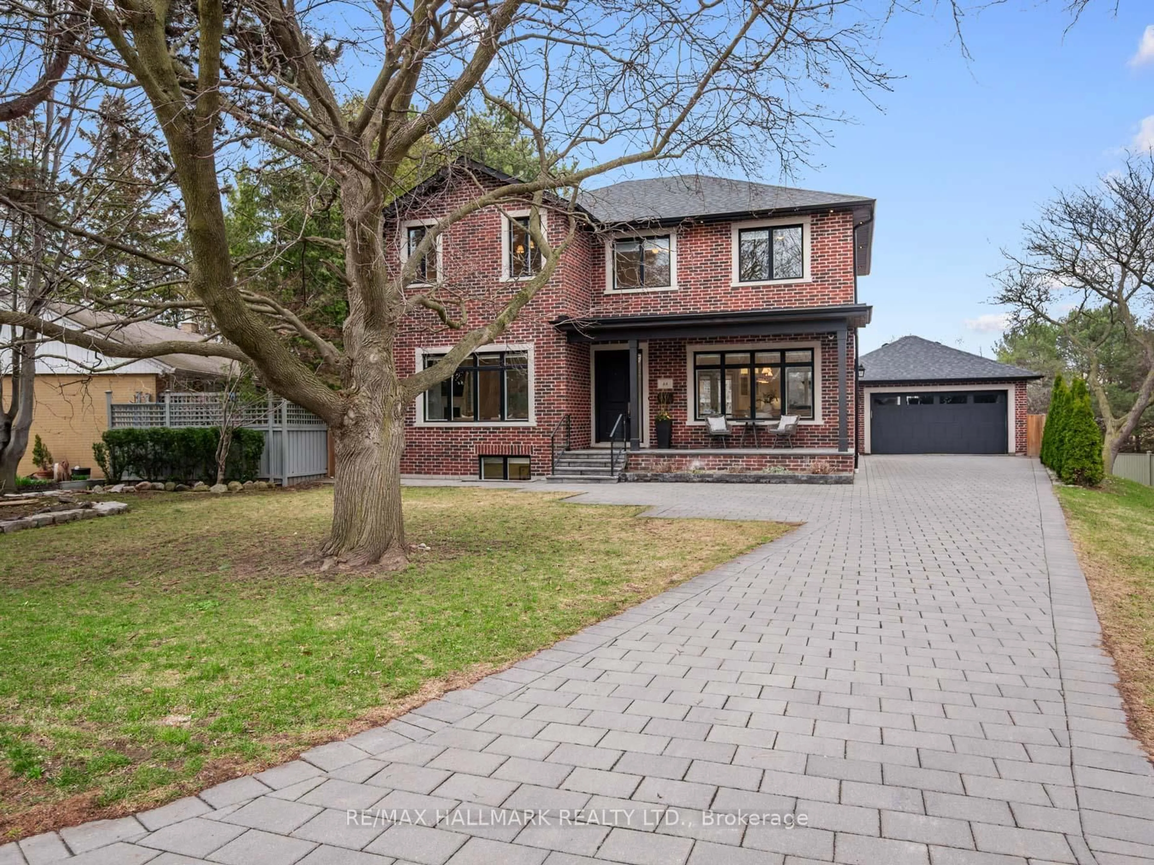 Home with brick exterior material, street for 48 Paperbirch Dr, Toronto Ontario M3C 2E7
