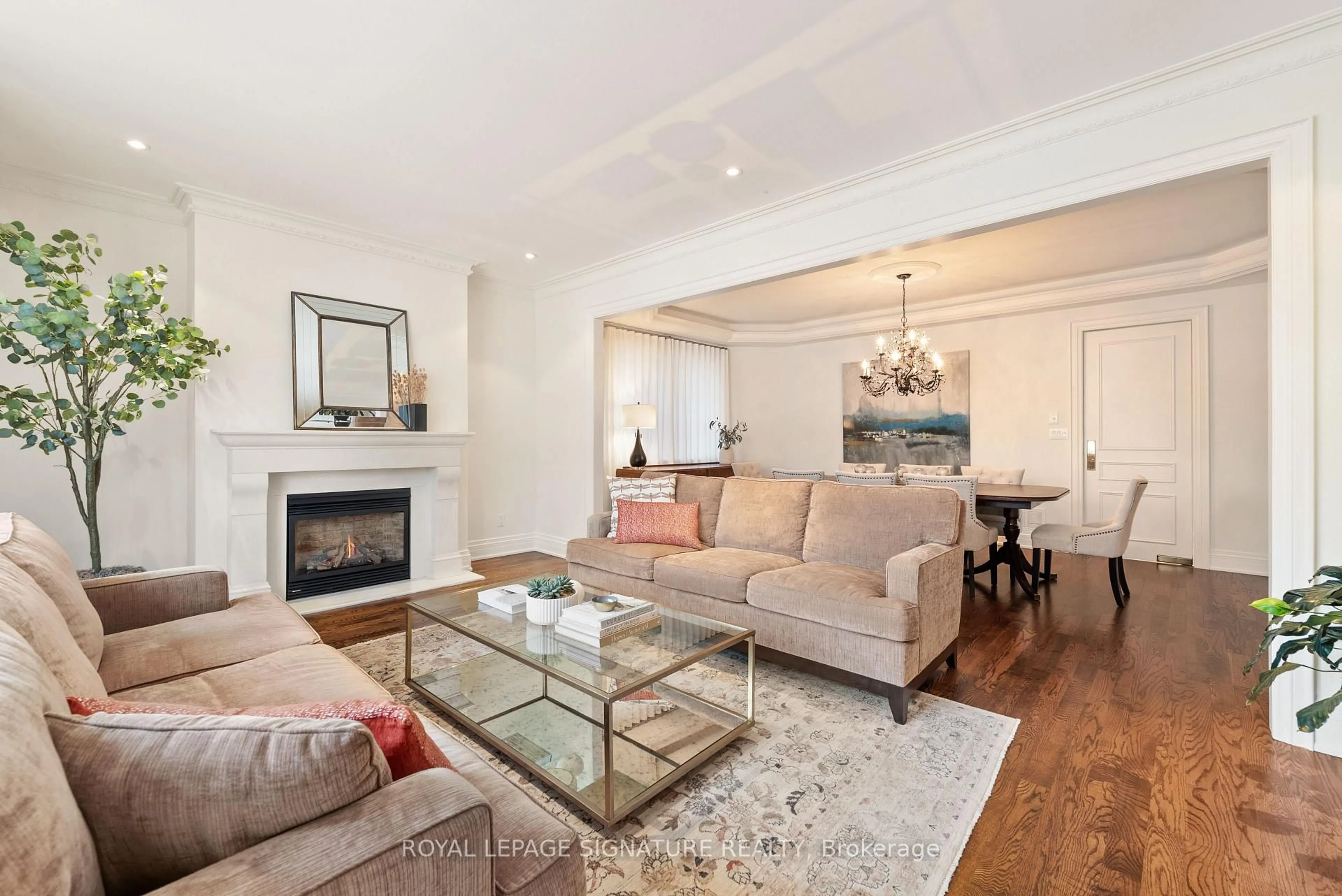 Living room with furniture, wood/laminate floor for 68 Carmichael Ave, Toronto Ontario M5M 2W7