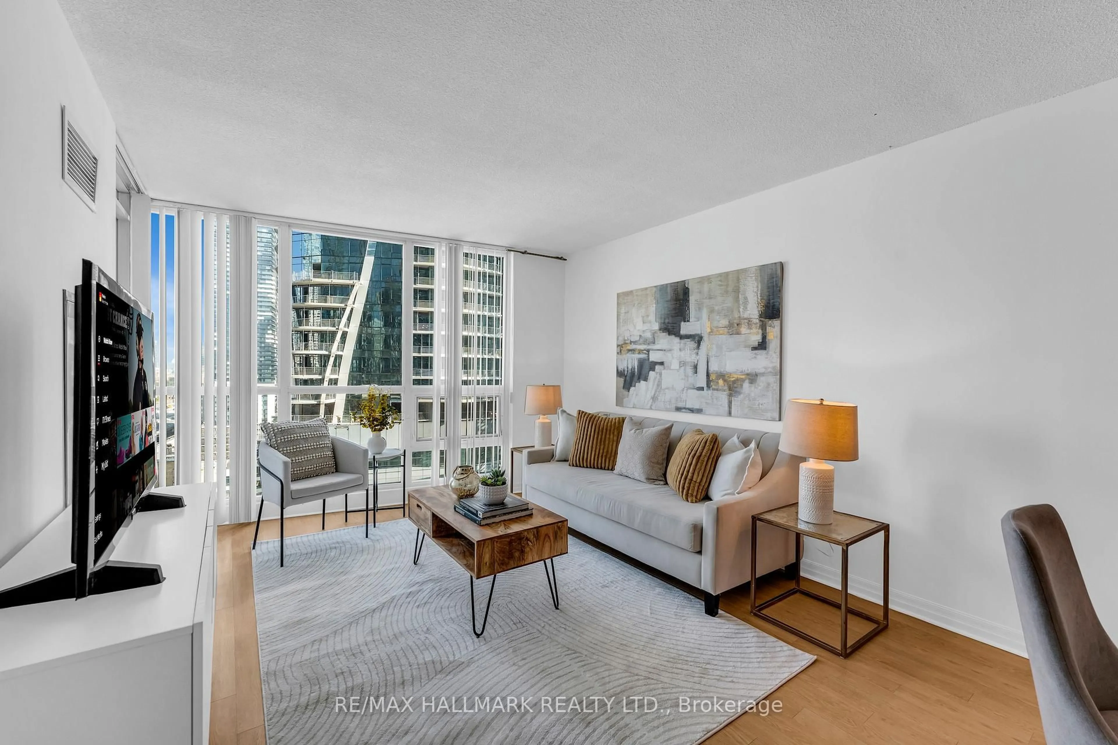 Living room with furniture, unknown for 16 Yonge St #1908, Toronto Ontario M5E 2A1