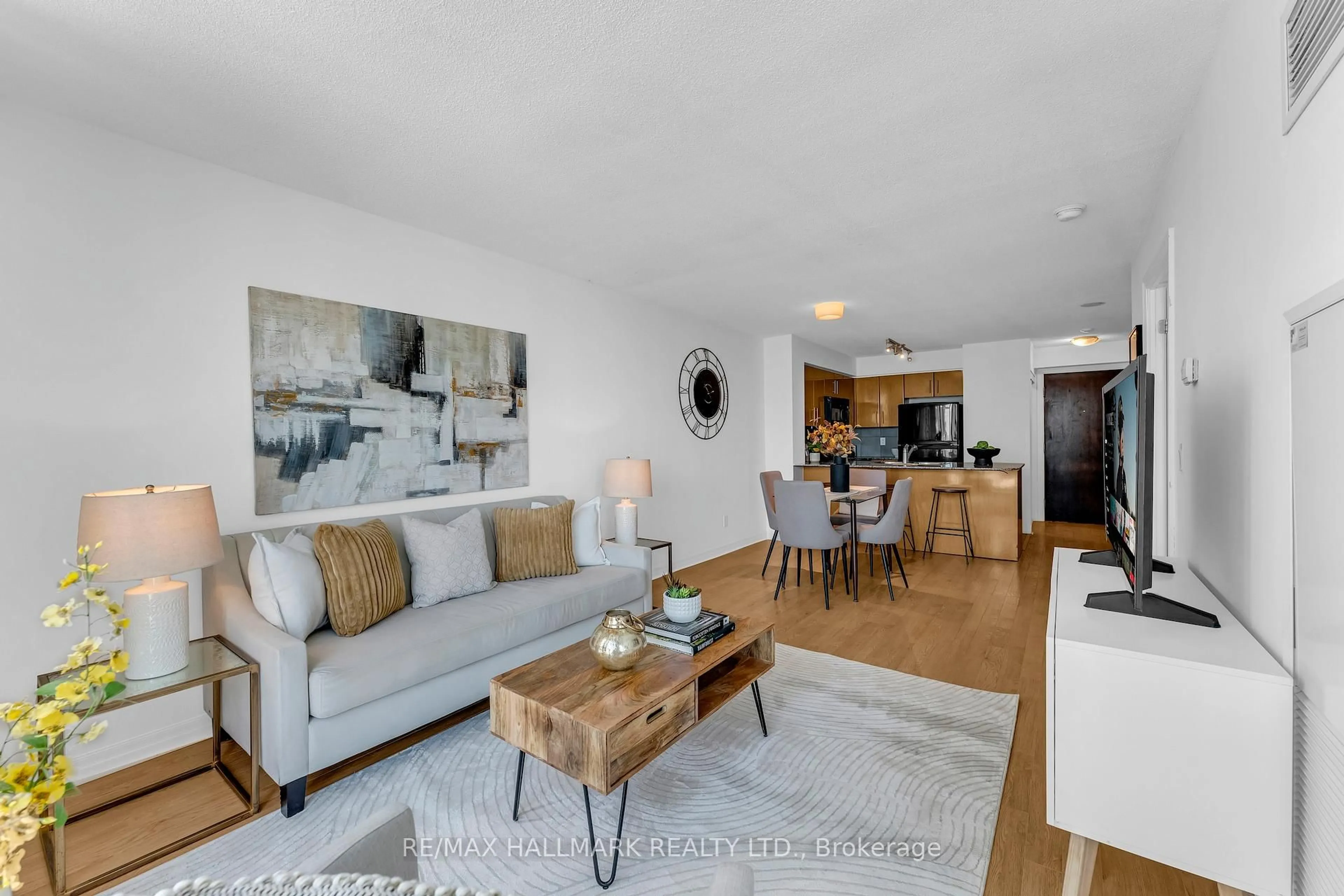 Living room with furniture, wood/laminate floor for 16 Yonge St #1908, Toronto Ontario M5E 2A1