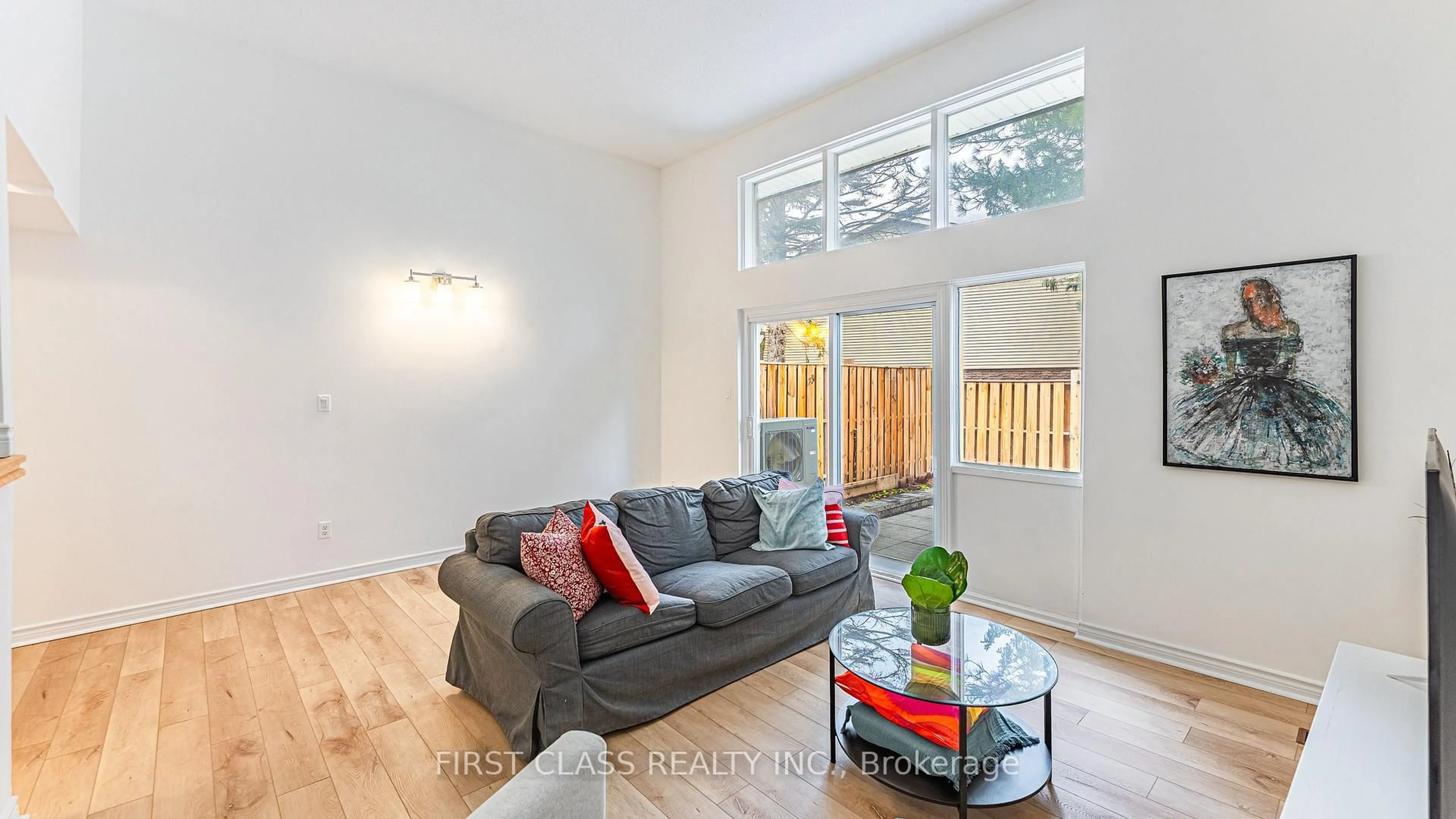 Living room with furniture, wood/laminate floor for 102 Jenny Wrenway Way, Toronto Ontario M2H 2Z2