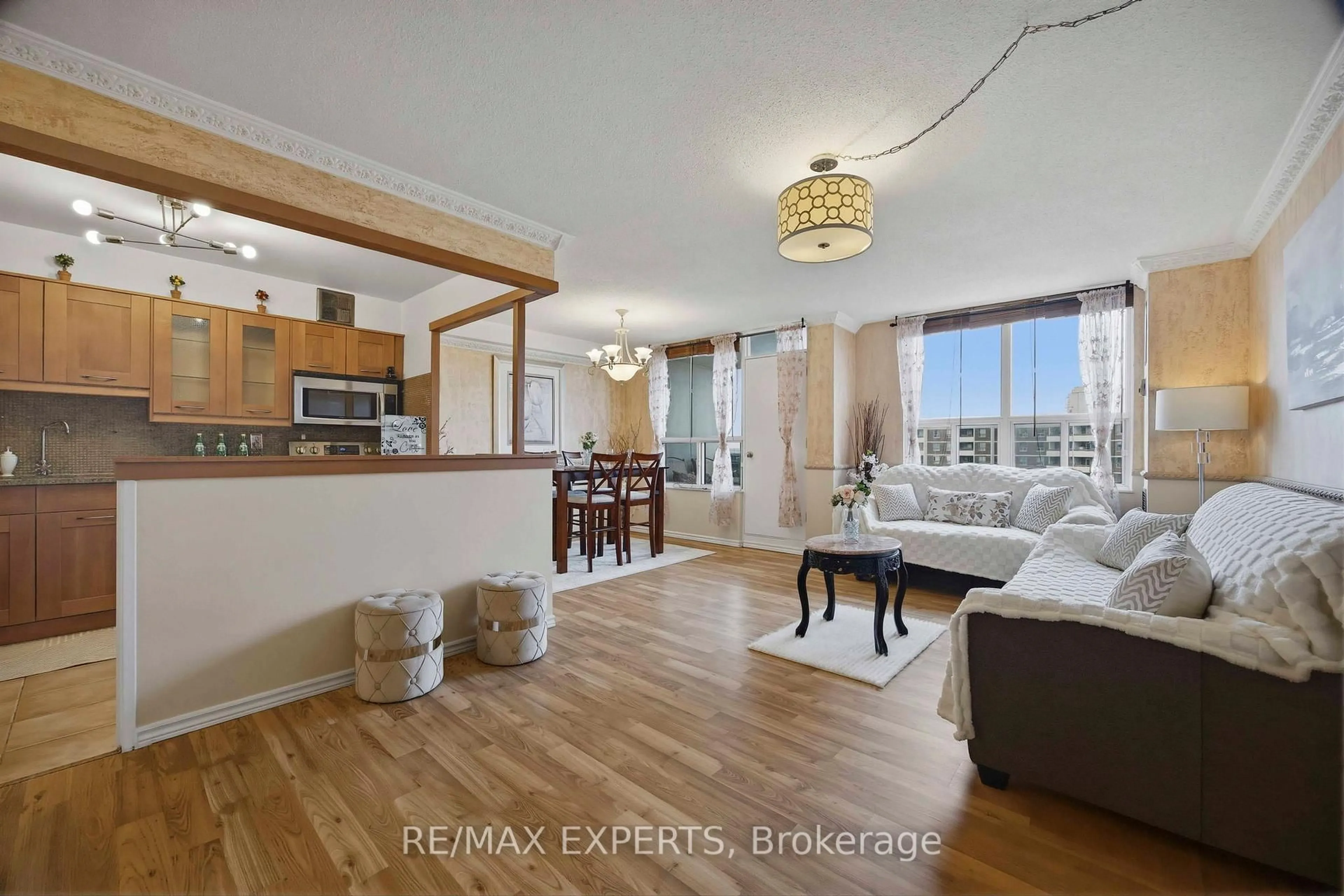 Living room with furniture, wood/laminate floor for 5 Shady Gfwy #1417, Toronto Ontario M3C 3A5