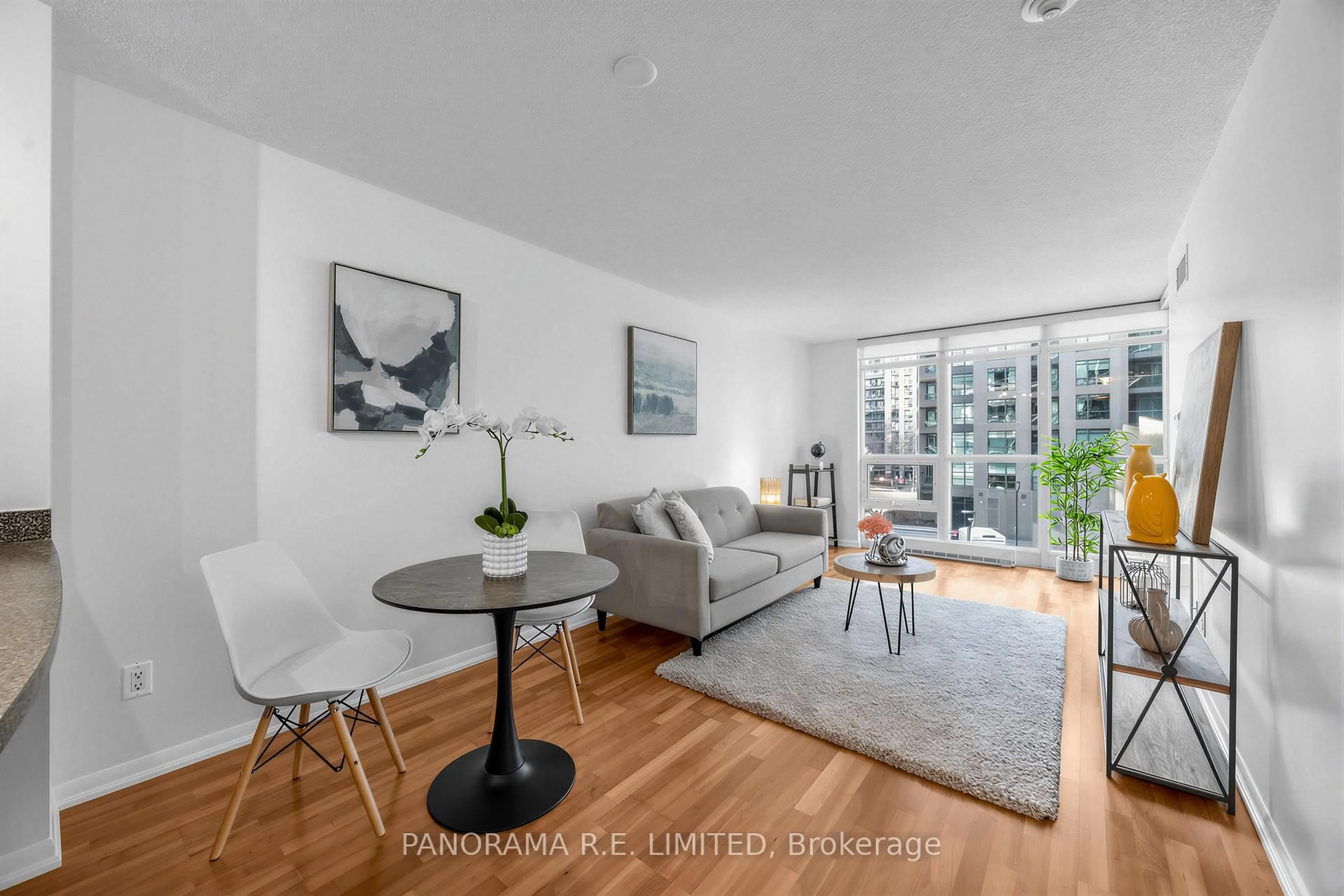 Living room with furniture, wood/laminate floor for 231 Fort York Blvd #306, Toronto Ontario M5V 1B2