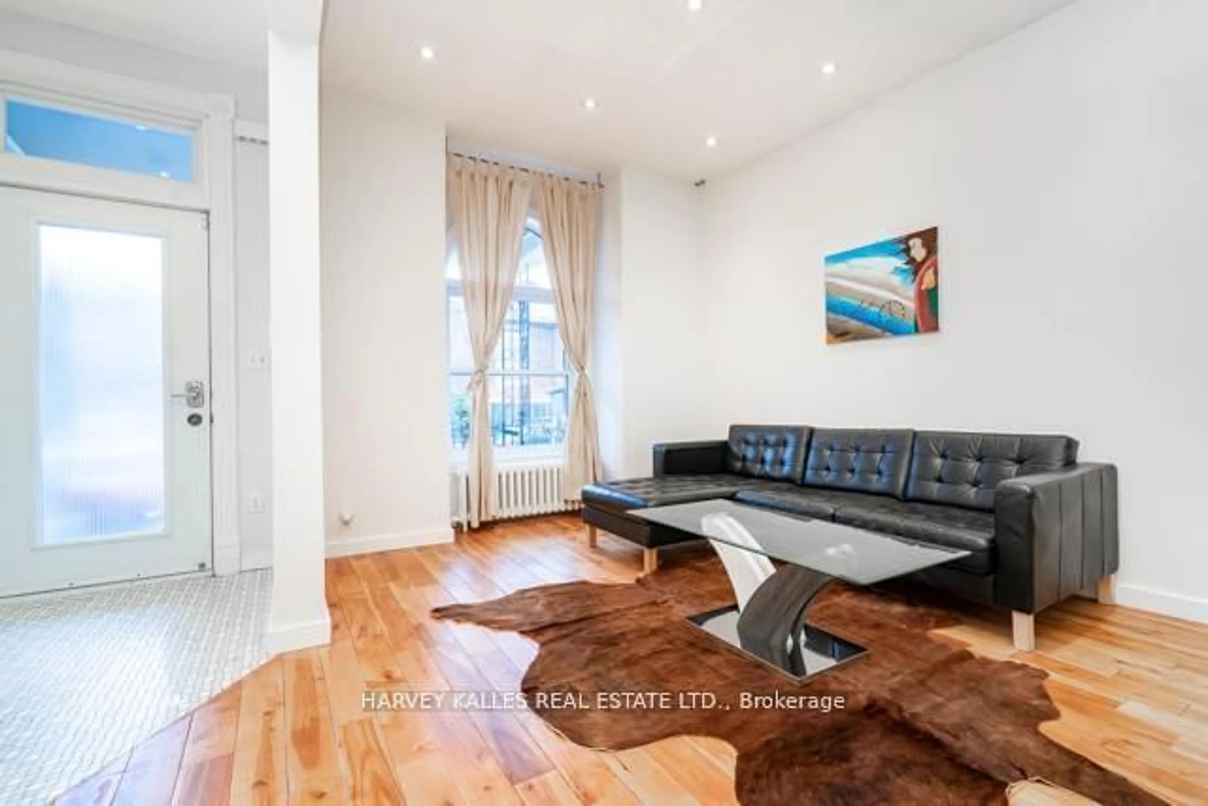 Living room with furniture, wood/laminate floor for 178 Manning Ave, Toronto Ontario M6J 2K5