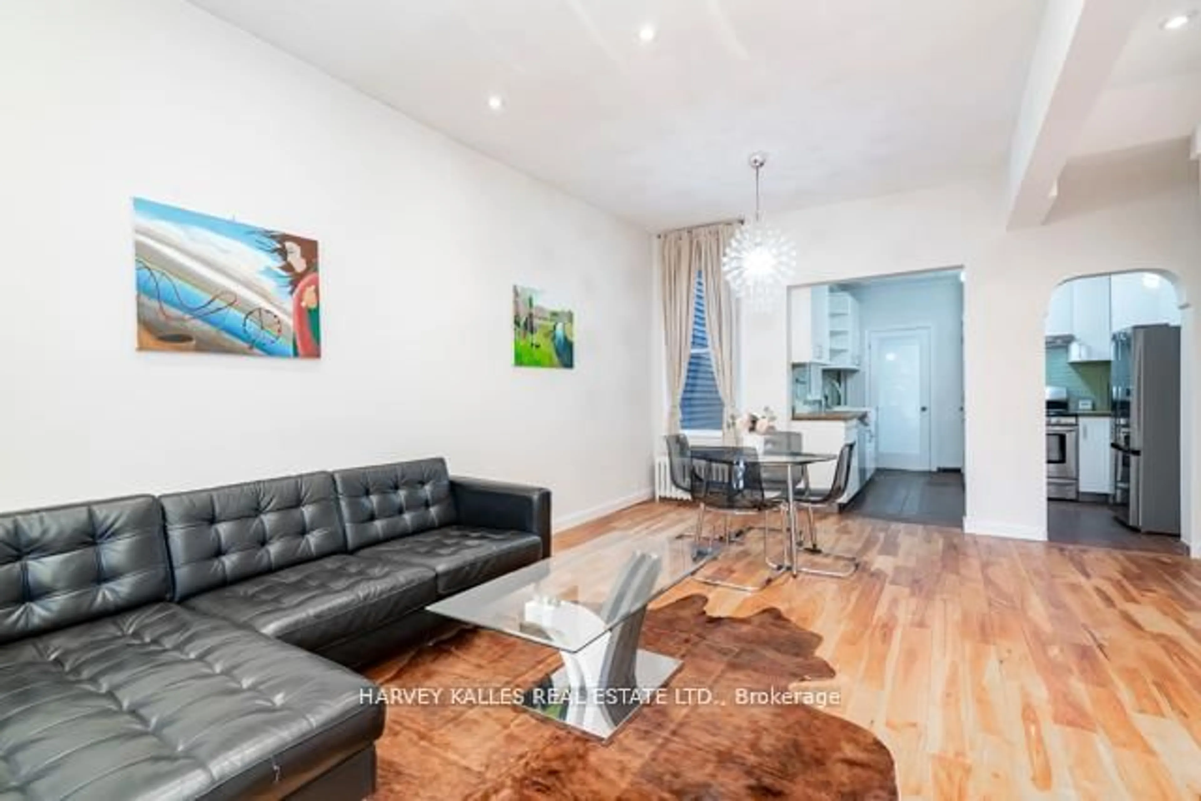 Living room with furniture, wood/laminate floor for 178 Manning Ave, Toronto Ontario M6J 2K5